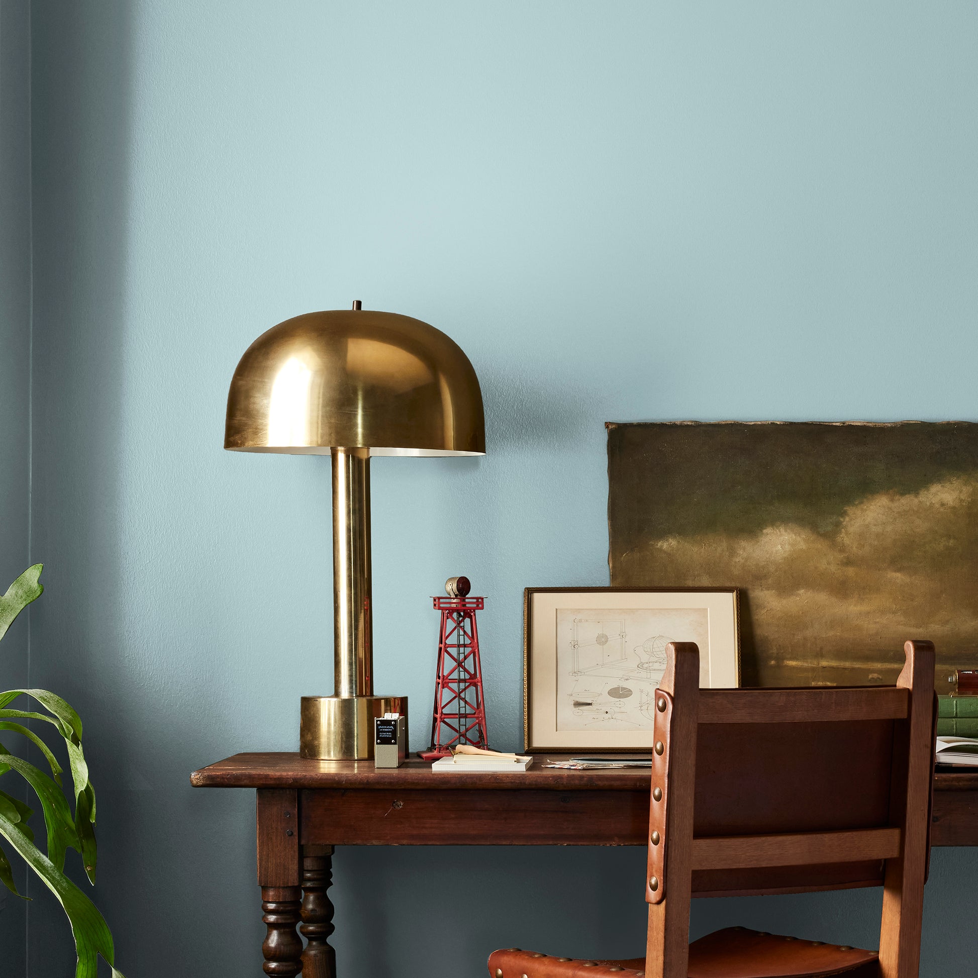 A muted blue interior paint named vibrant horizon shown painted on bedroom wall