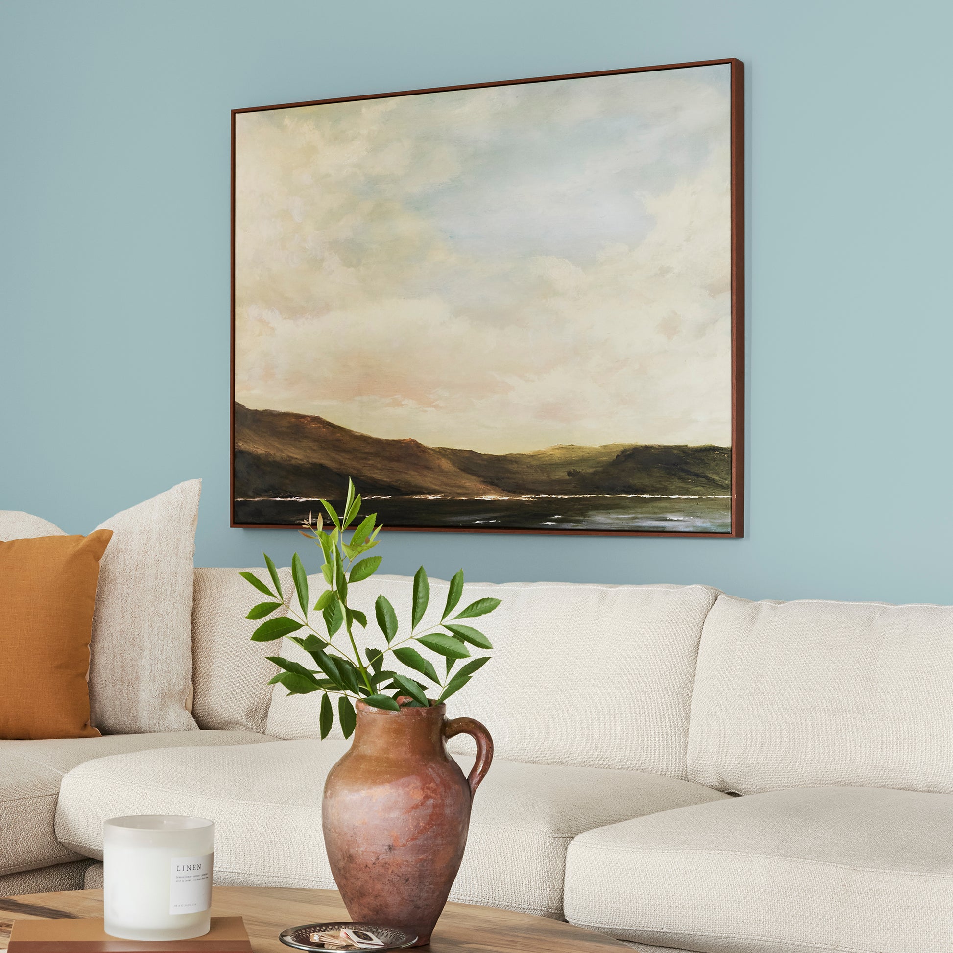 A muted blue interior paint named vibrant horizon shown painted on living room wall