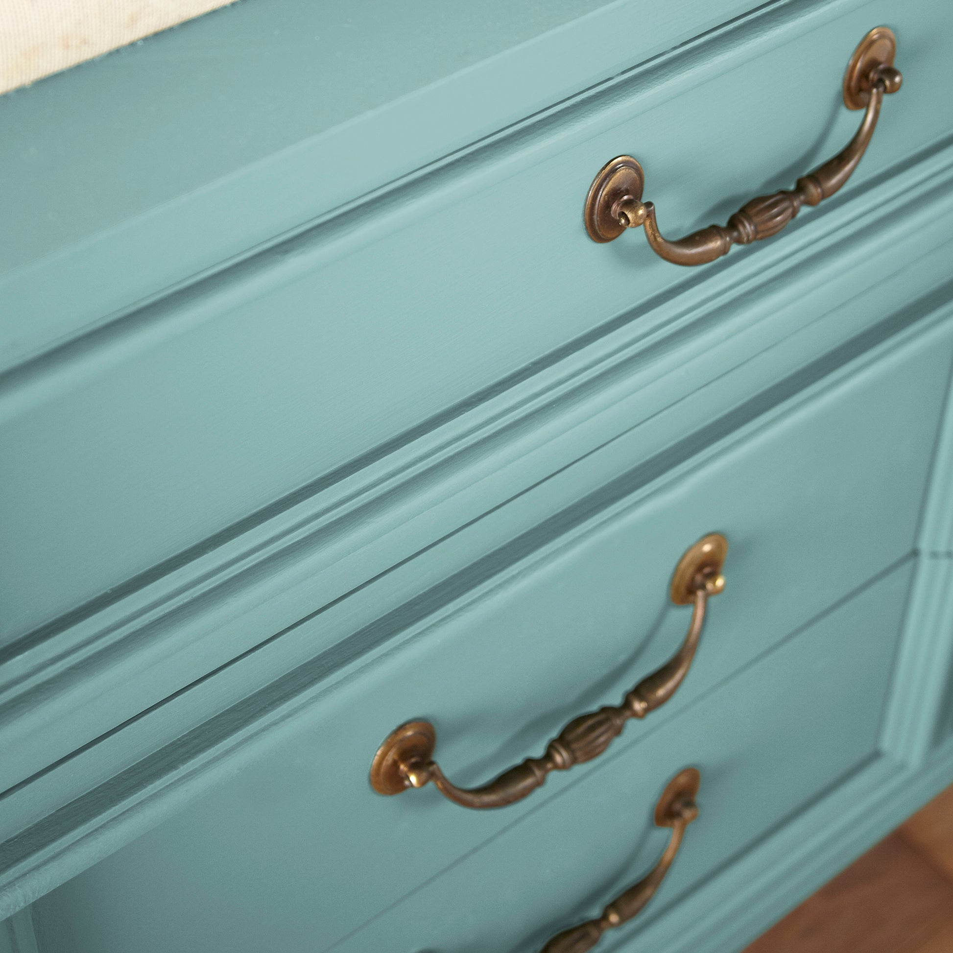 A cool aqua blue door and cabinet paint named morning calm shown painted on cabinet