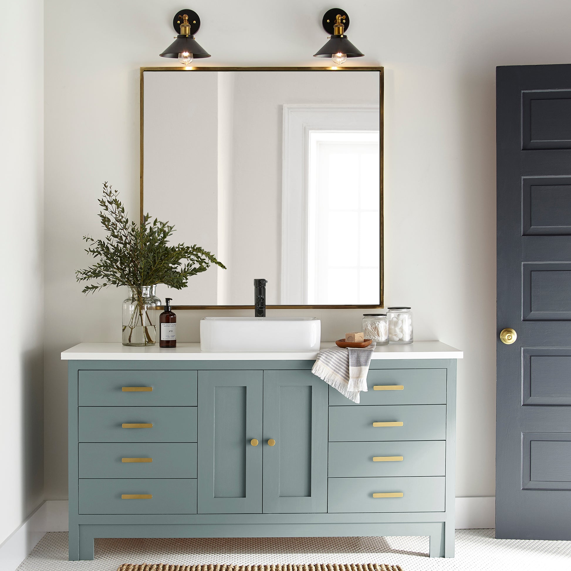 Ashy green with aqua undertones door and cabinet paint named well watered shown painted on bathroom cabinet