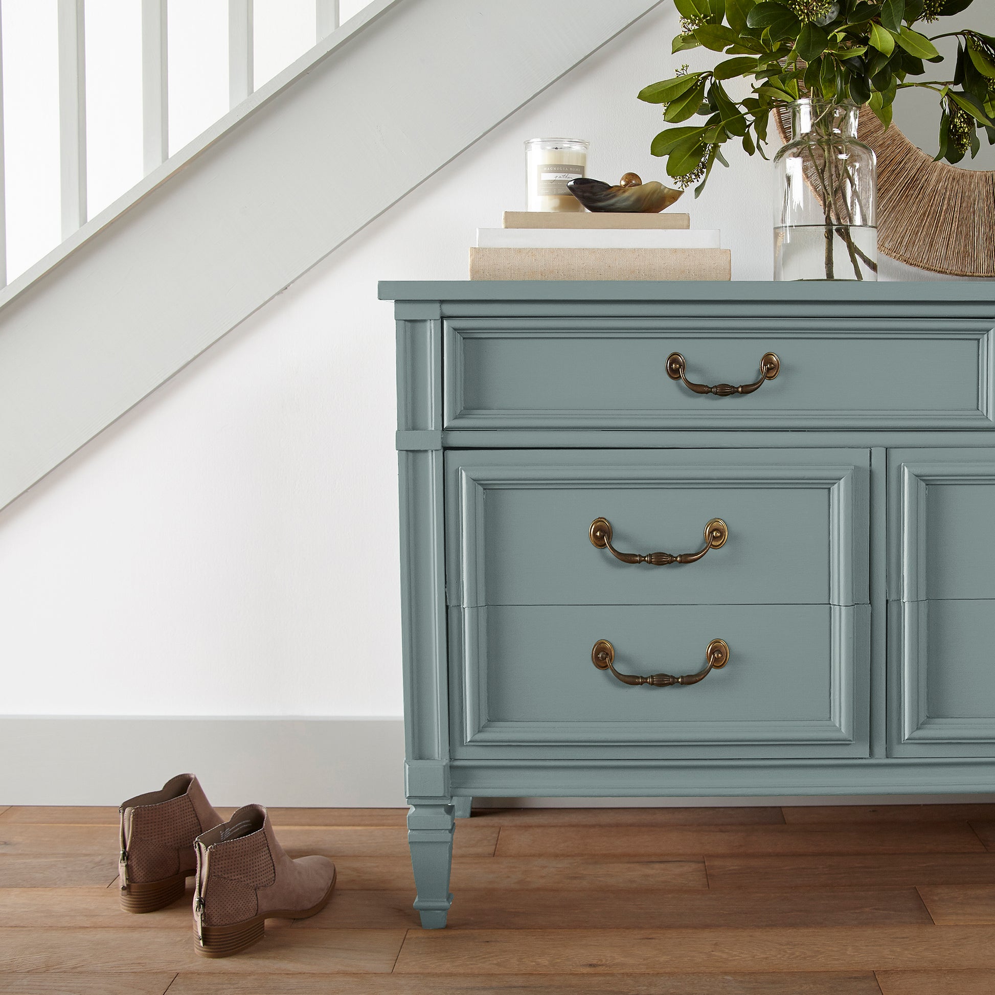 Ashy green with aqua undertones door and cabinet paint named well watered shown painted on entryway cabinet