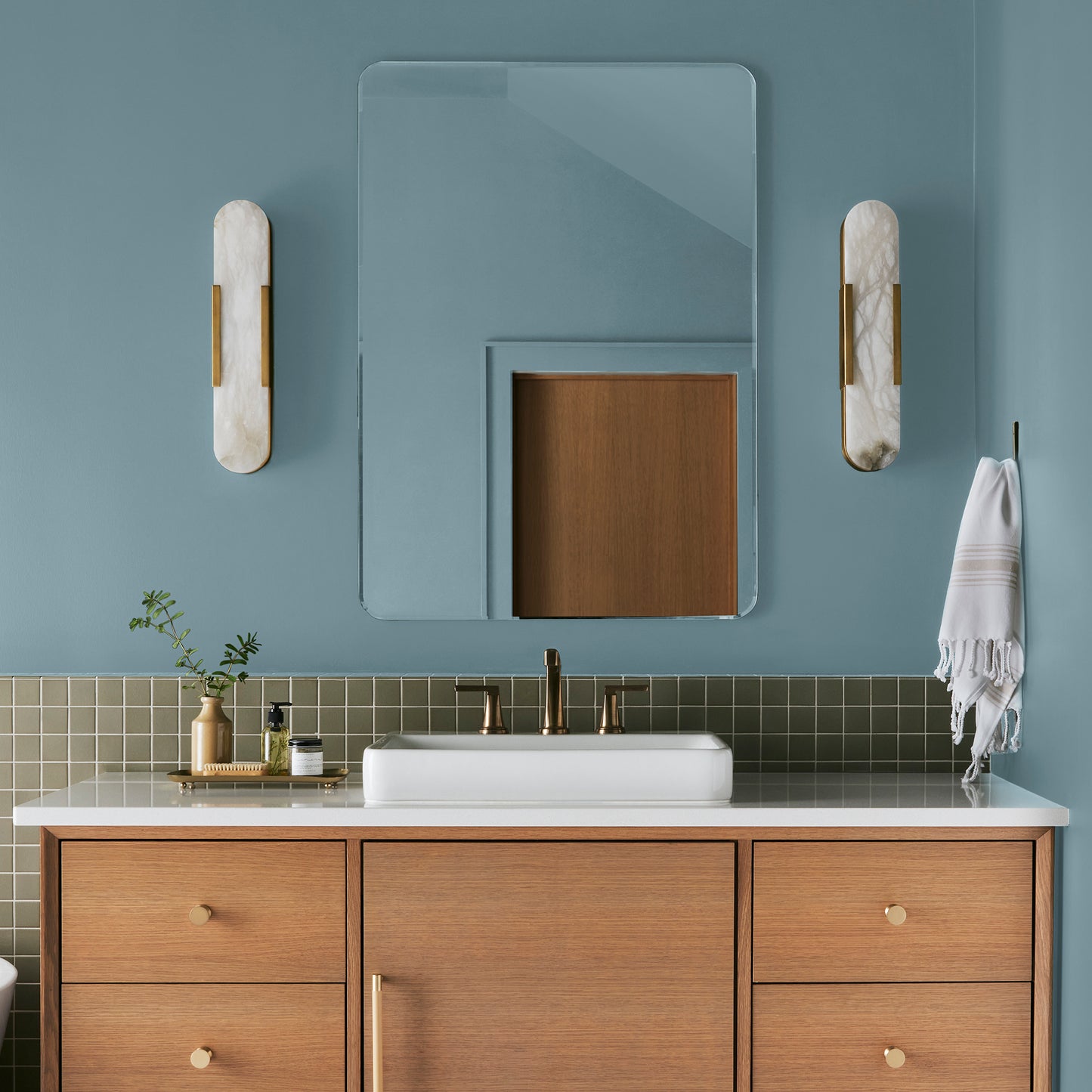 washed denim blue interior paint named winter solstice shown painted on bathroom wall