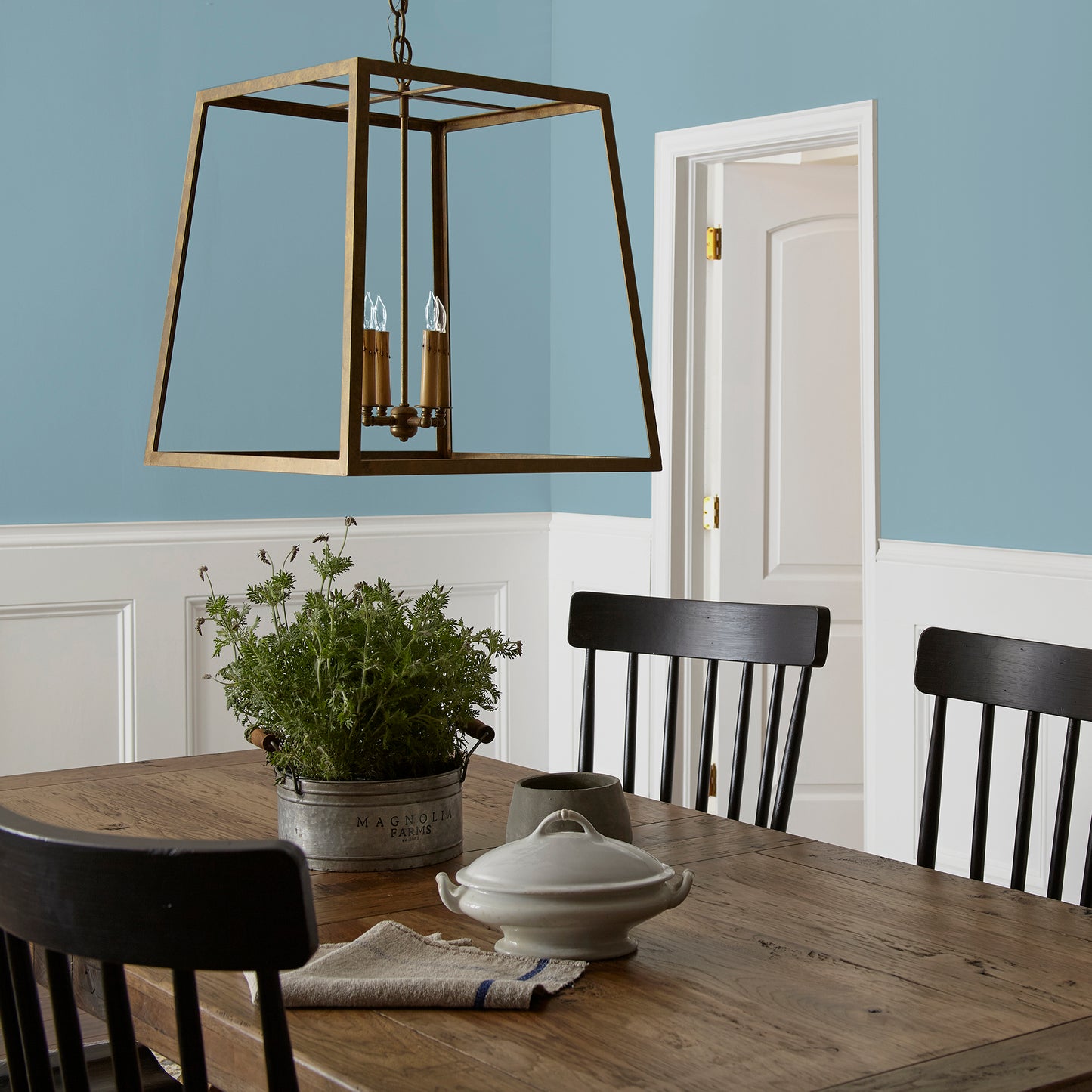 washed denim blue interior paint named winter solstice shown painted on dining room wall
