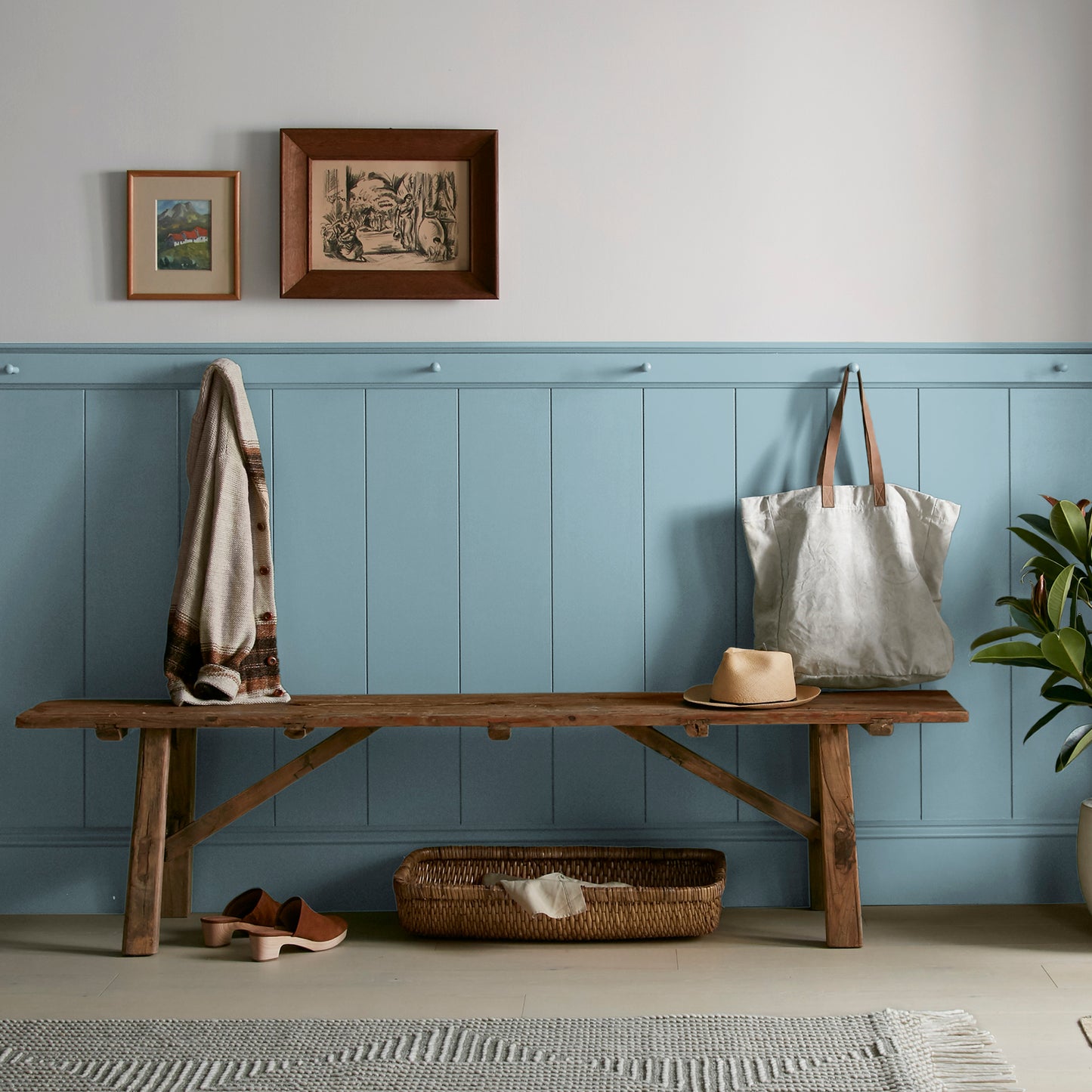 washed denim blue interior paint named winter solstice shown painted on entryway wall