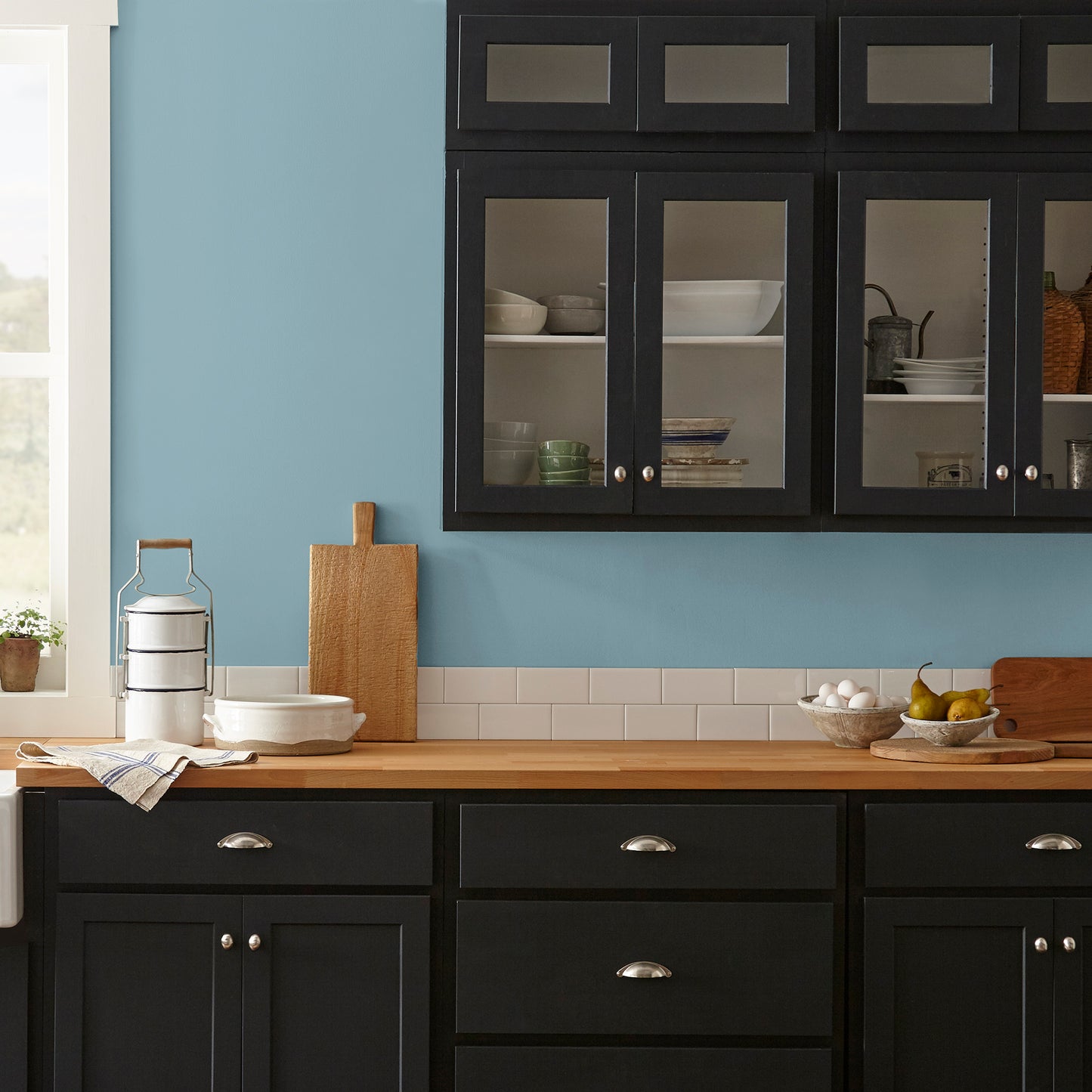 washed denim blue interior paint named winter solstice shown painted on kitchen wall