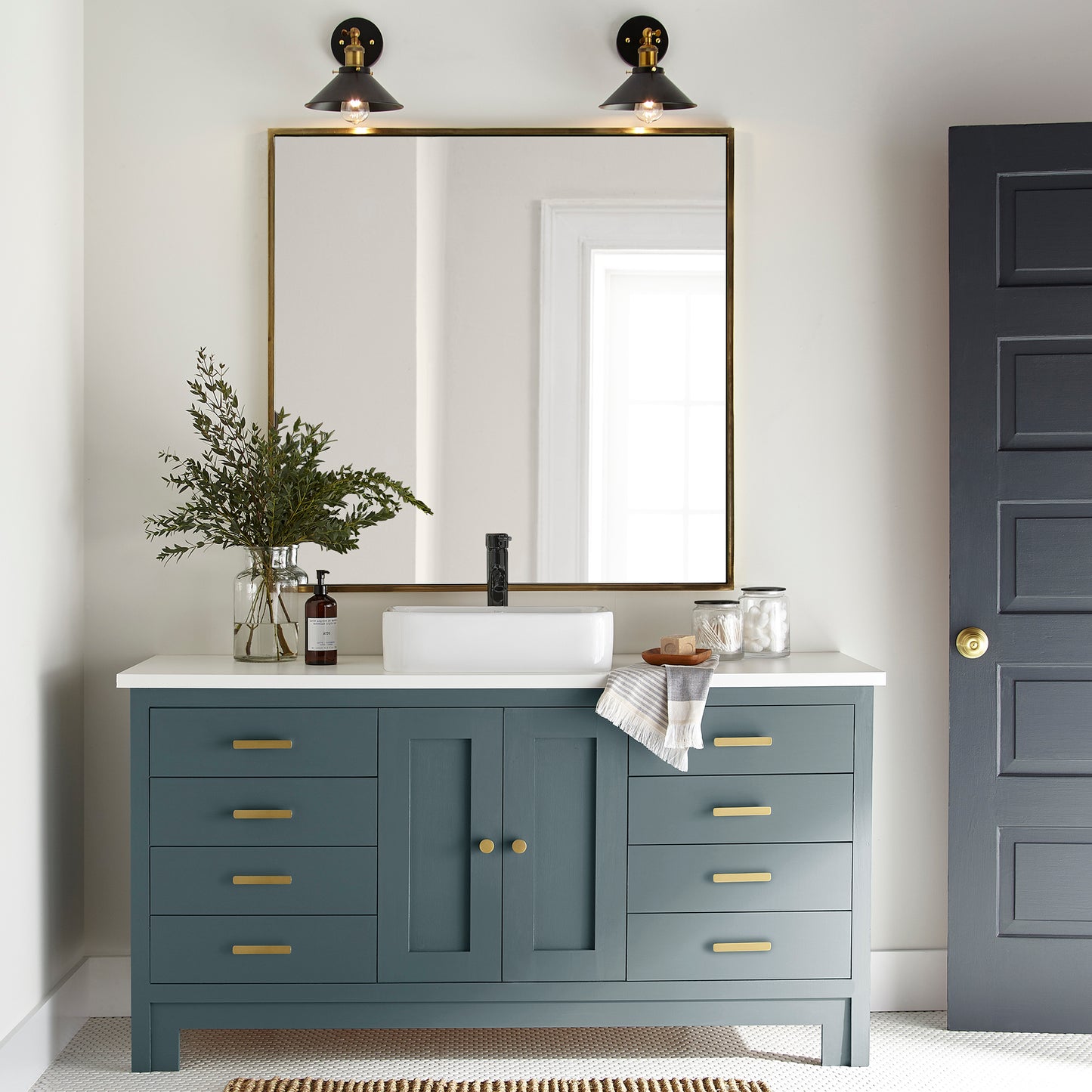 Deep sea blue with a gray caste door and cabinet paint named together shown painted on bathroom cabinet