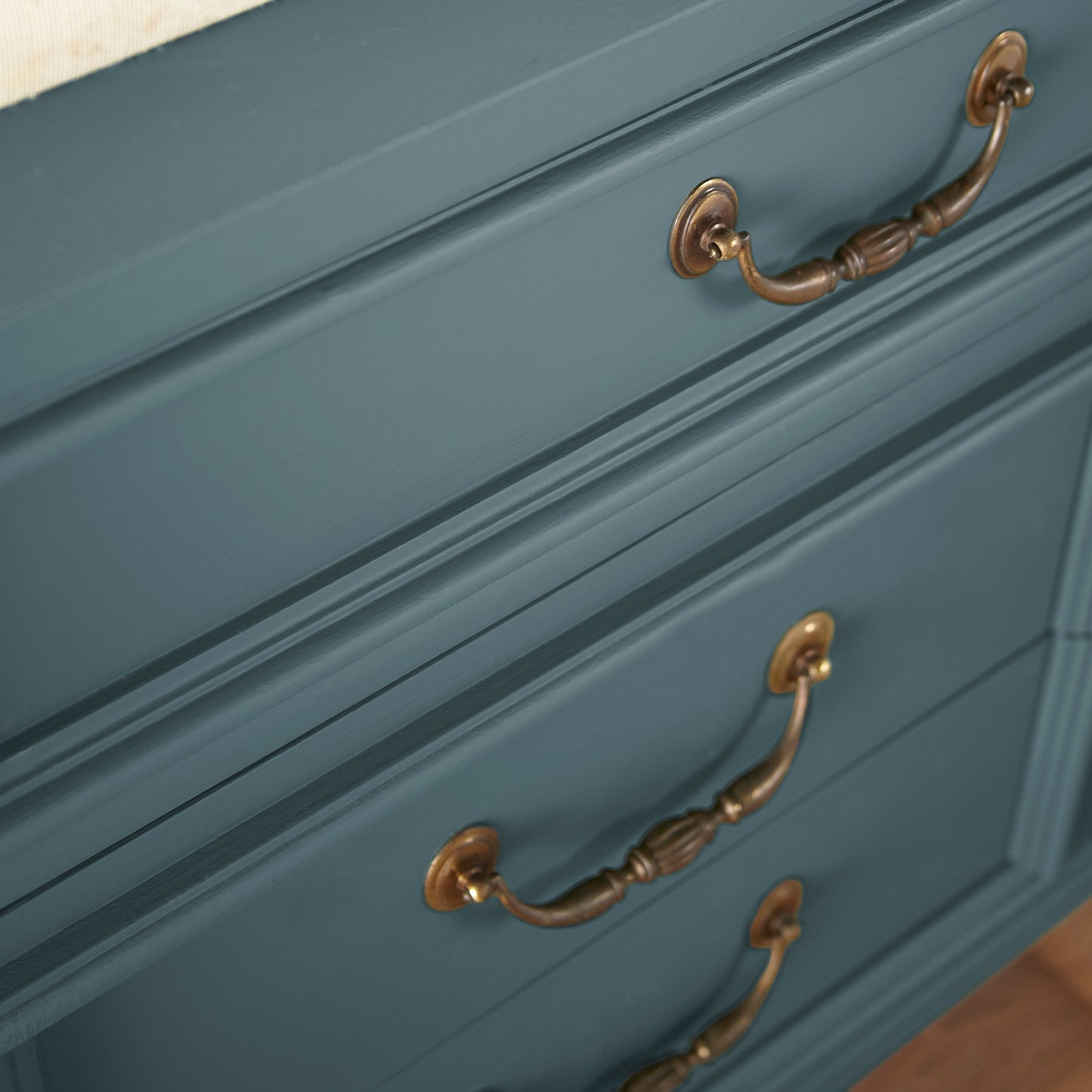 Deep sea blue with a gray caste door and cabinet paint named together shown painted on cabinet
