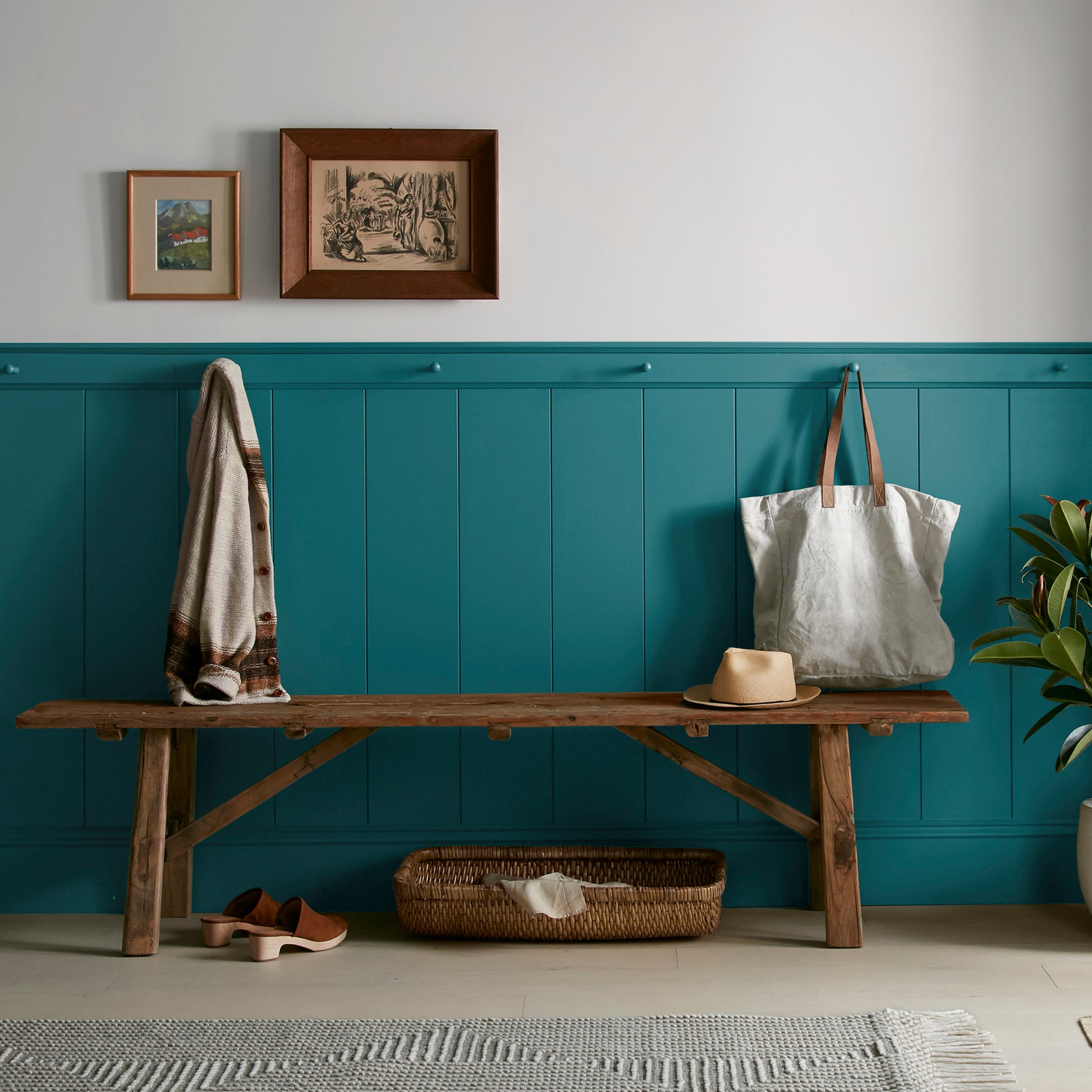 A deep peacock blue interior paint named under the stars shown painted on entryway wall
