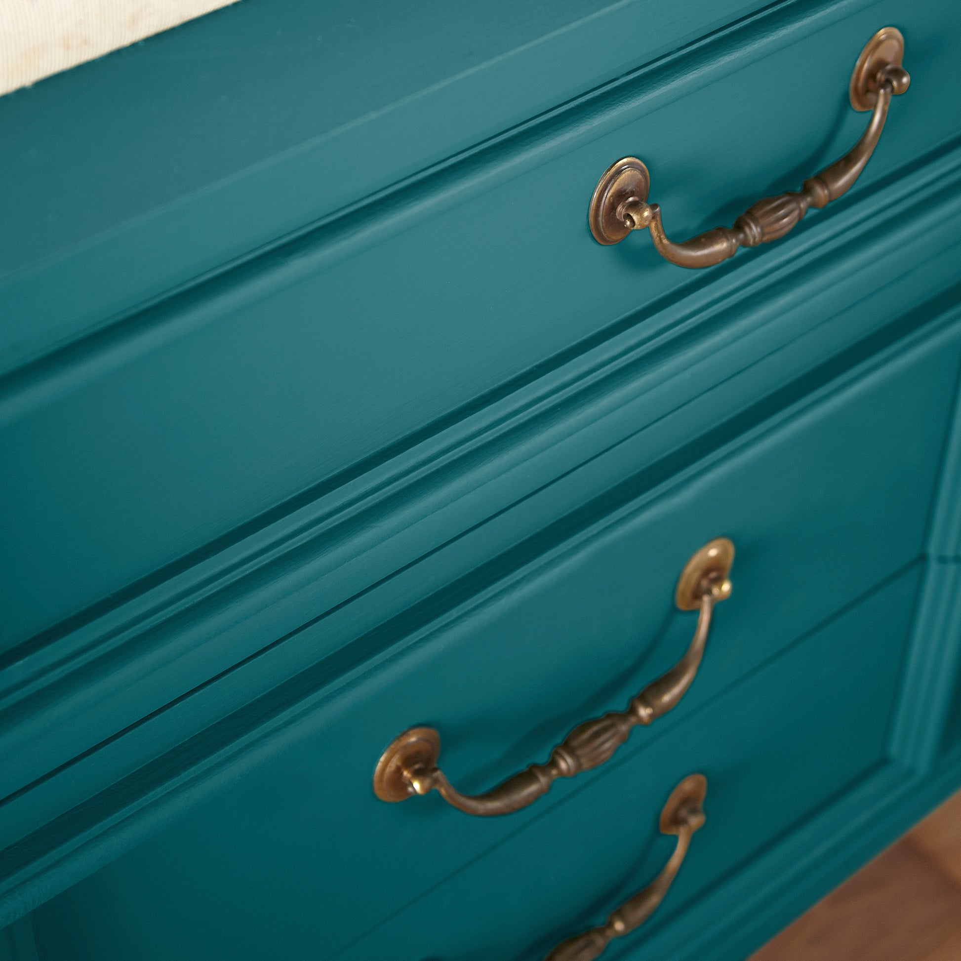 A deep peacock blue door and cabinet paint named under the stars shown painted on cabinet