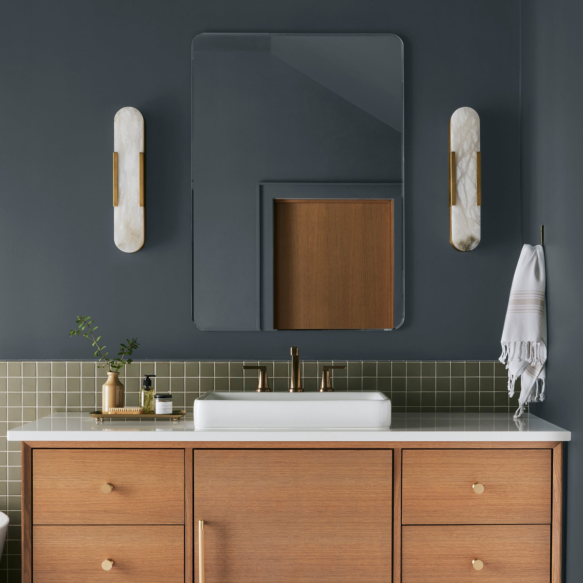 Almost black with dark blue undertones interior paint named arches shown painted on bathroom wall