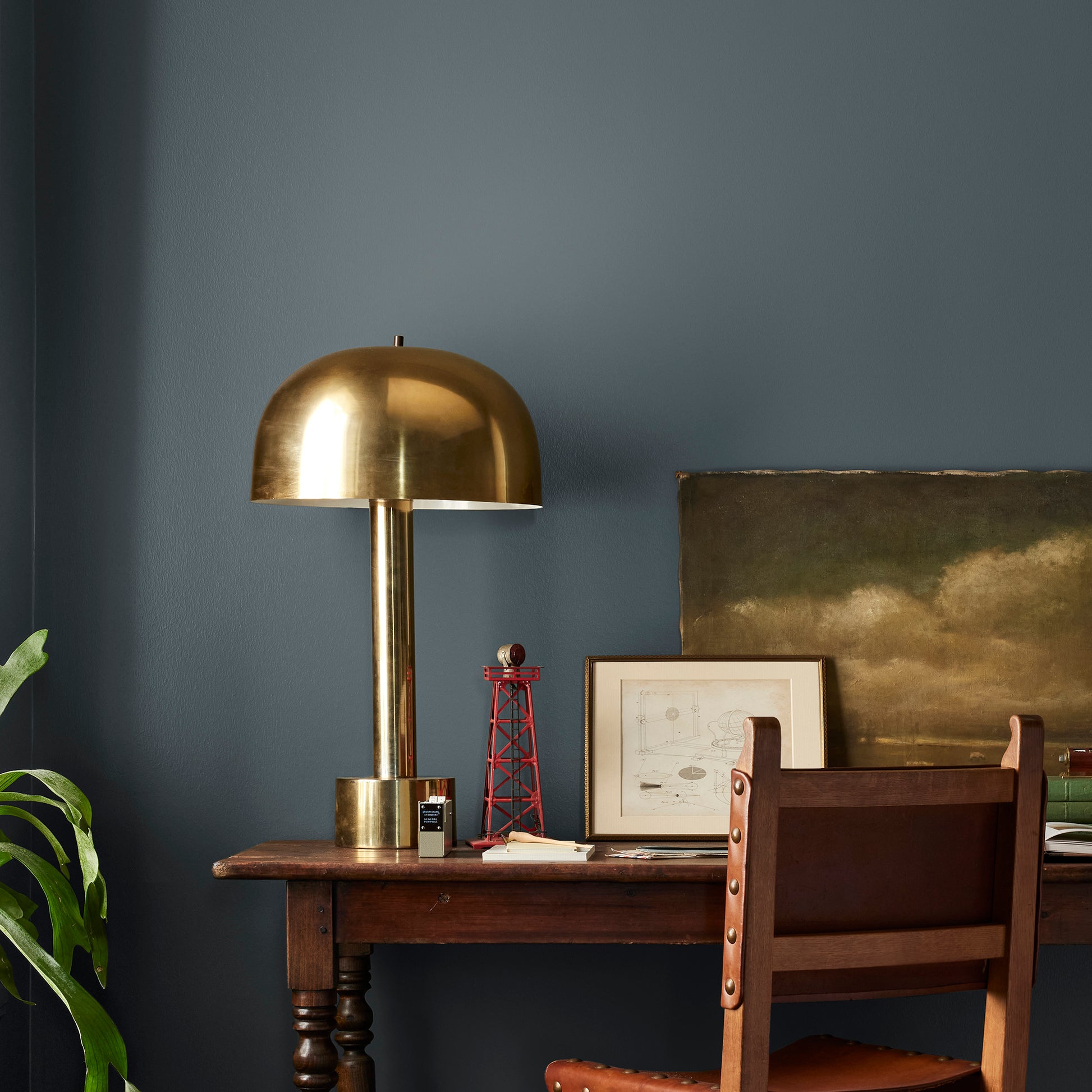 Almost black with dark blue undertones interior paint named arches shown painted on bedroom wall