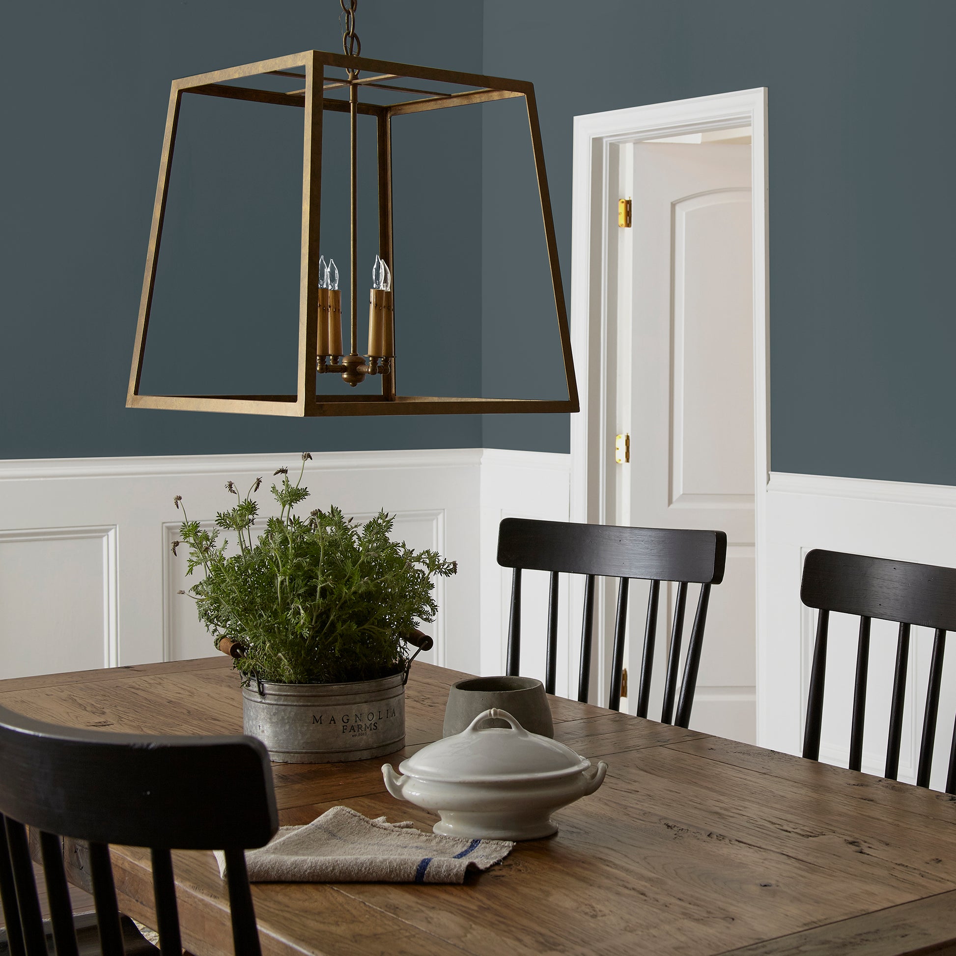 Almost black with dark blue undertones interior paint named arches shown painted on dining room wall