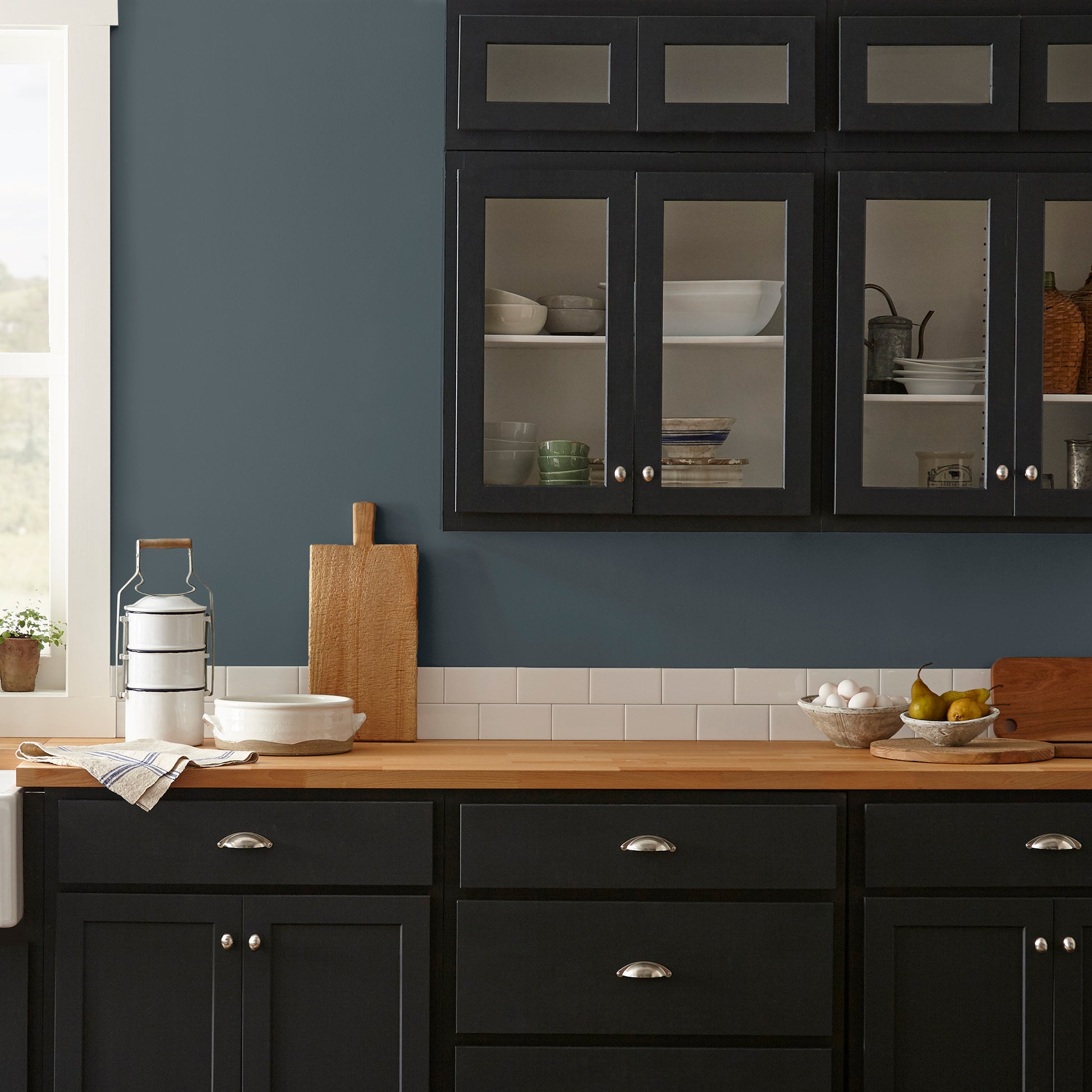 Almost black with dark blue undertones interior paint named arches shown painted on kitchen wall