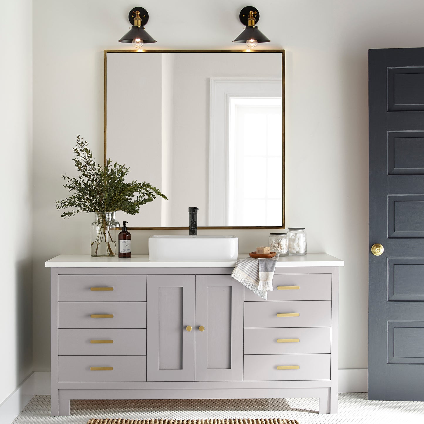 A muted lavender door and cabinet paint named in bloom shown painted on bathroom cabinet