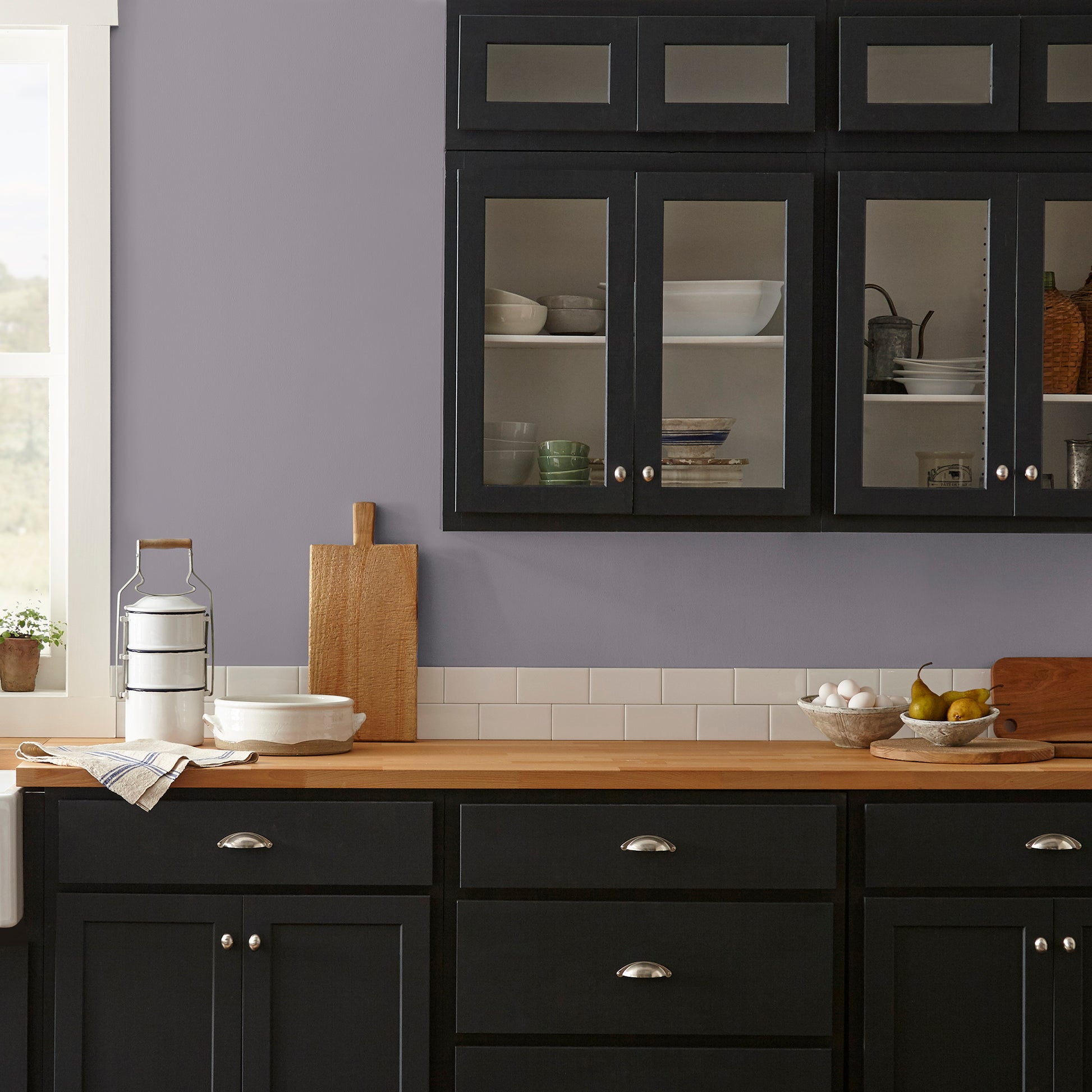deep pastel purple paint named pashmina plum shown painted on kitchen wall
