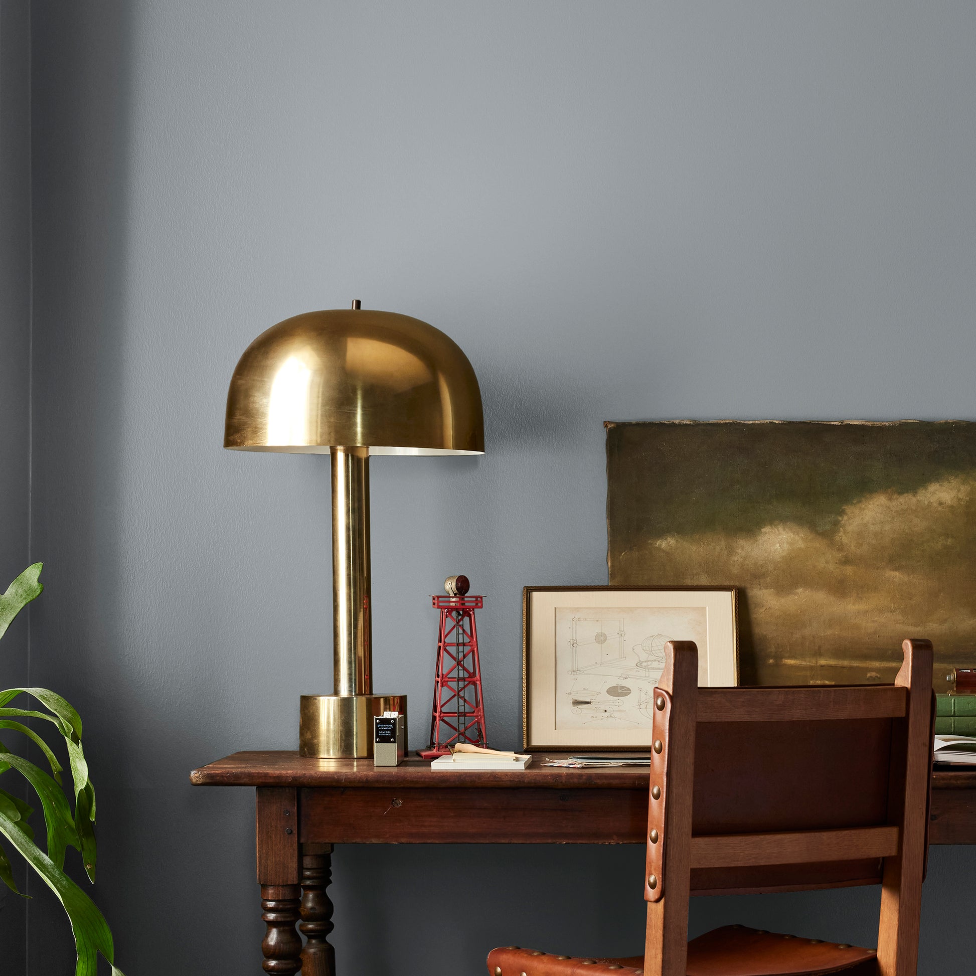 dark grey with blue undertone paint named deep rock shown painted on bedroom wall