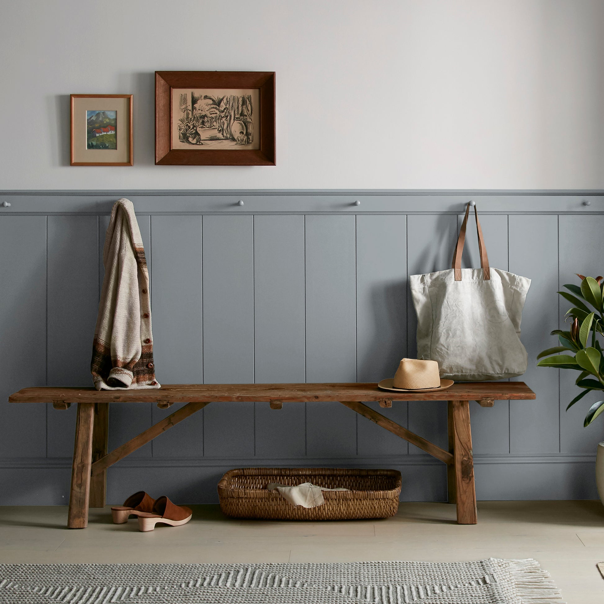 dark grey with blue undertone paint named deep rock shown painted on entryway wall