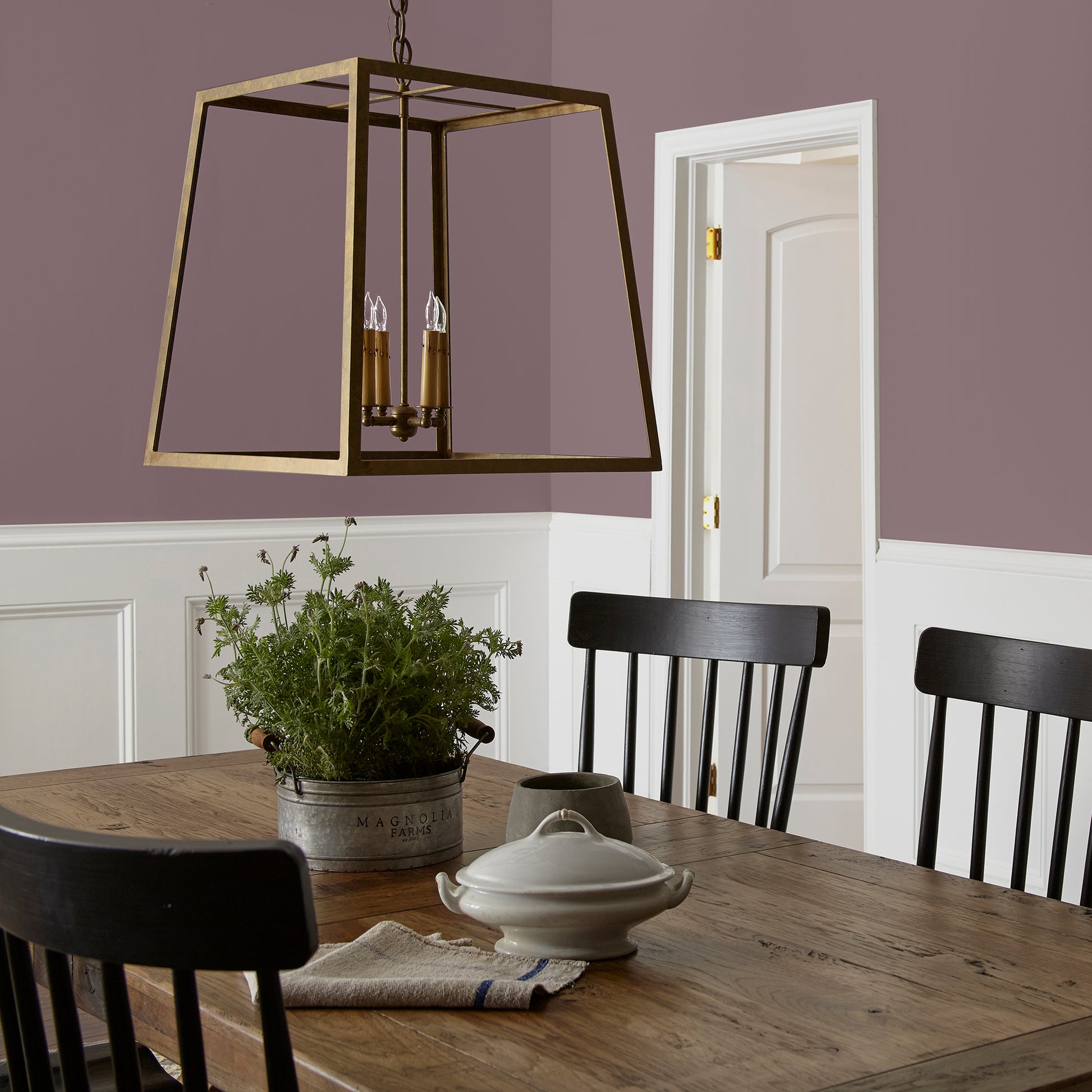 Deep and dusty berry interior paint named webster avenue shown painted on dining room wall