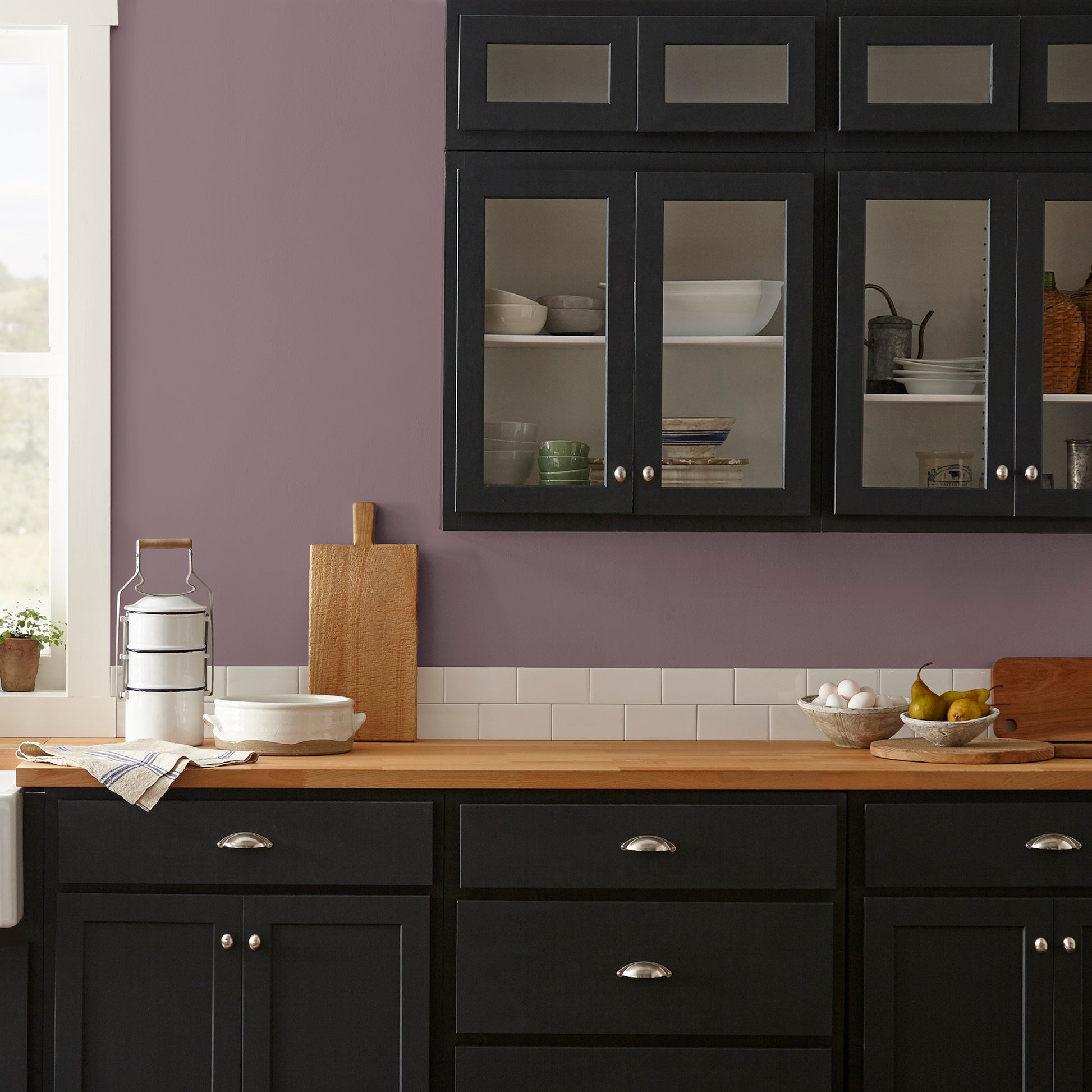 Deep and dusty berry interior paint named webster avenue shown painted on kitchen wall