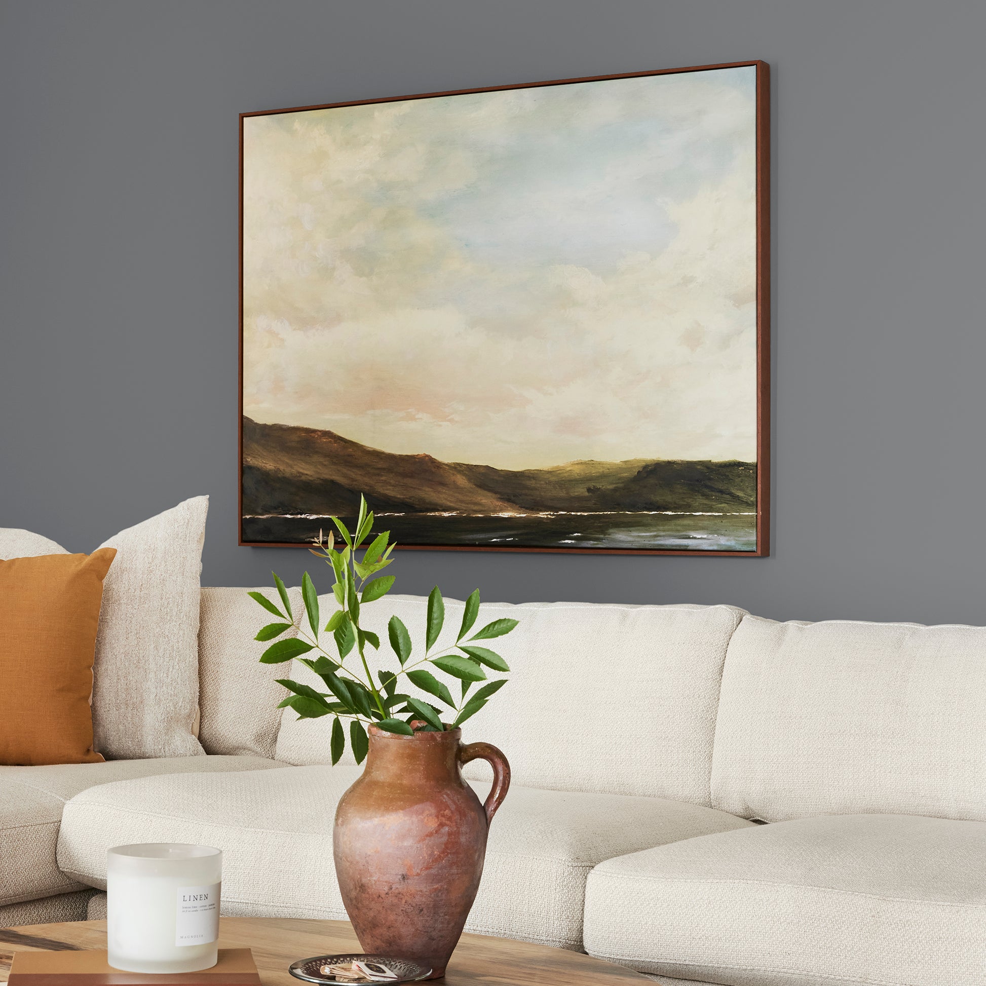Deep slate gray paint with blue undertones named texas storm shown painted on living room wall