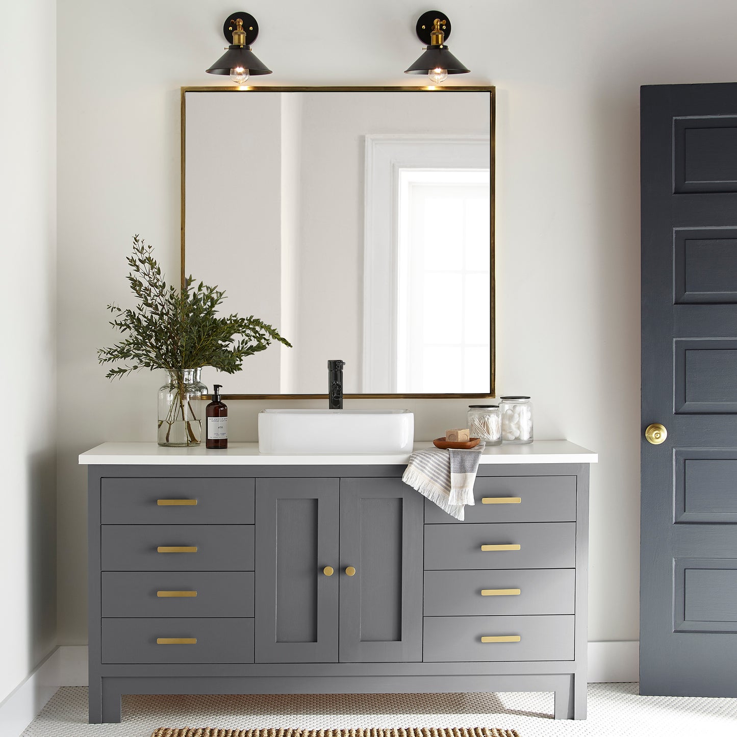 A dark charcoal gray door and cabinet paint named autumn gray shown painted on bathroom cabinet