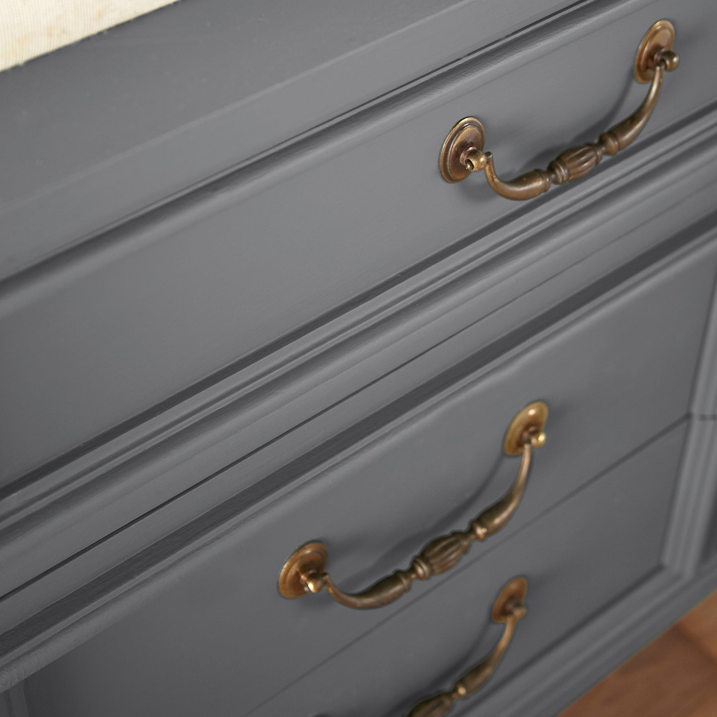 A dark charcoal gray door and cabinet paint named autumn gray shown painted on cabinet