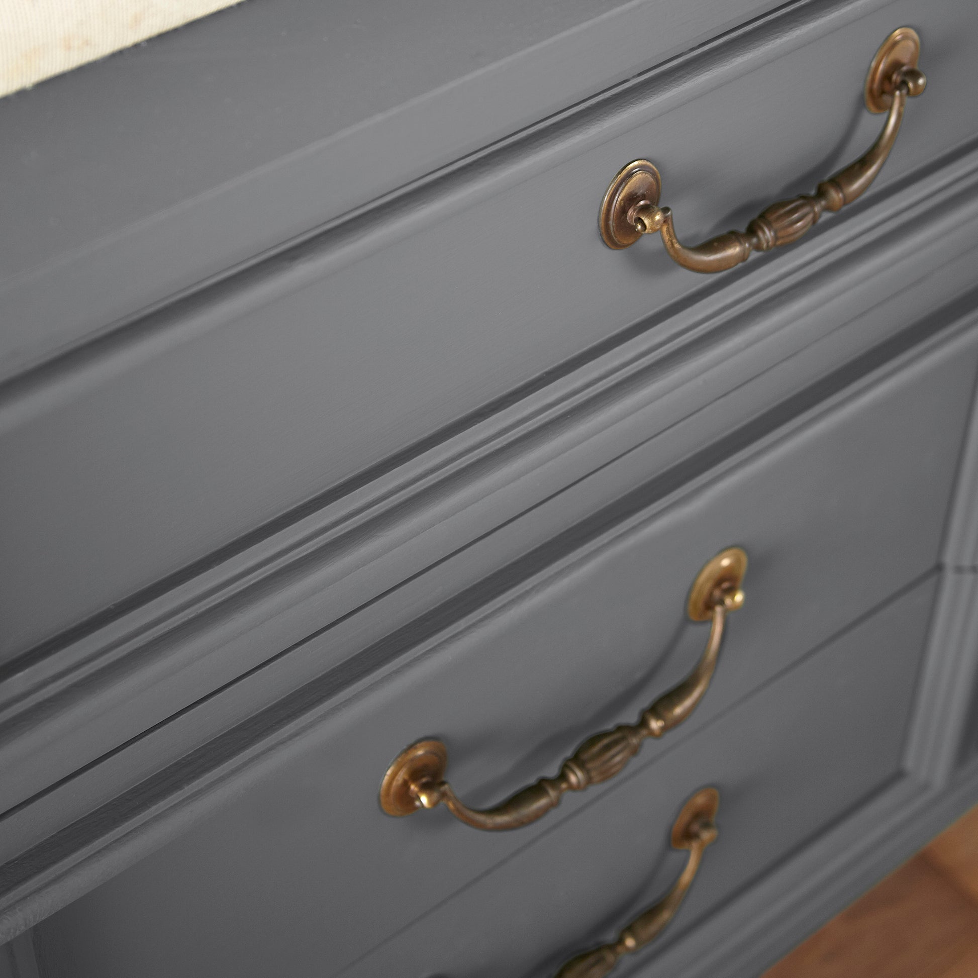 A dark charcoal gray door and cabinet paint named autumn gray shown painted on cabinet