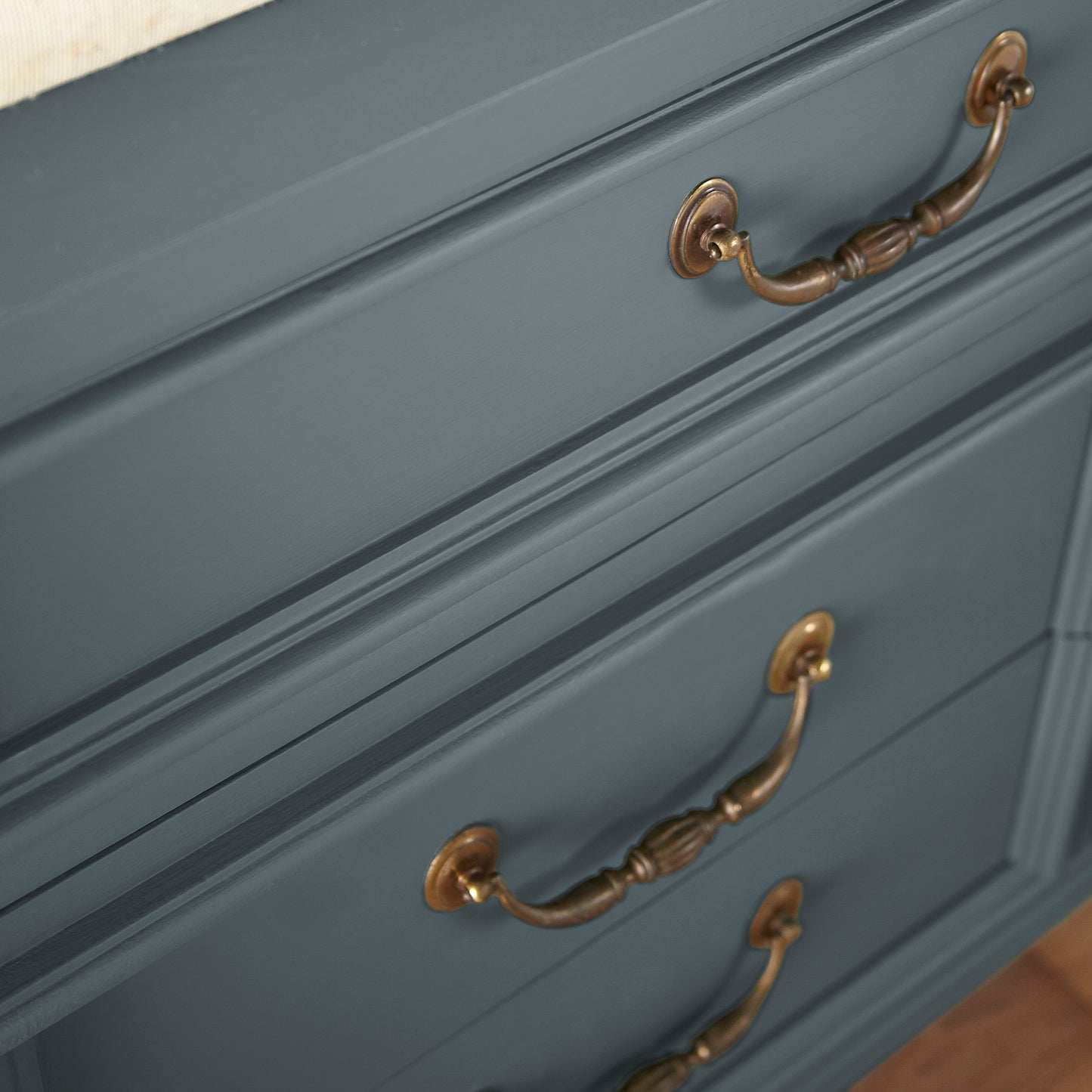 A dark smoky gray with blue undertones door and cabinet paint named coffee nook shown painted on cabinet