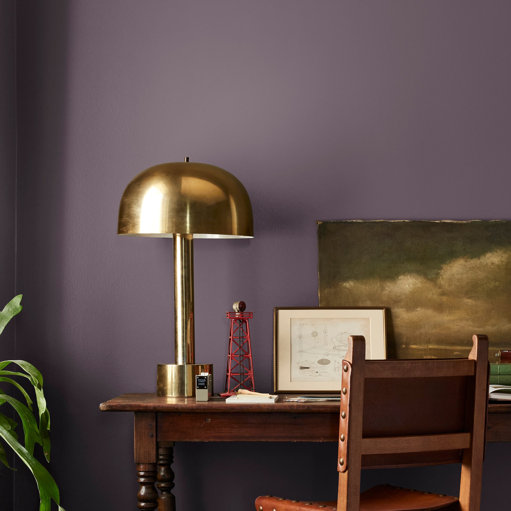 Deep eggplant purple interior paint named plum suede shown painted on bedroom wall