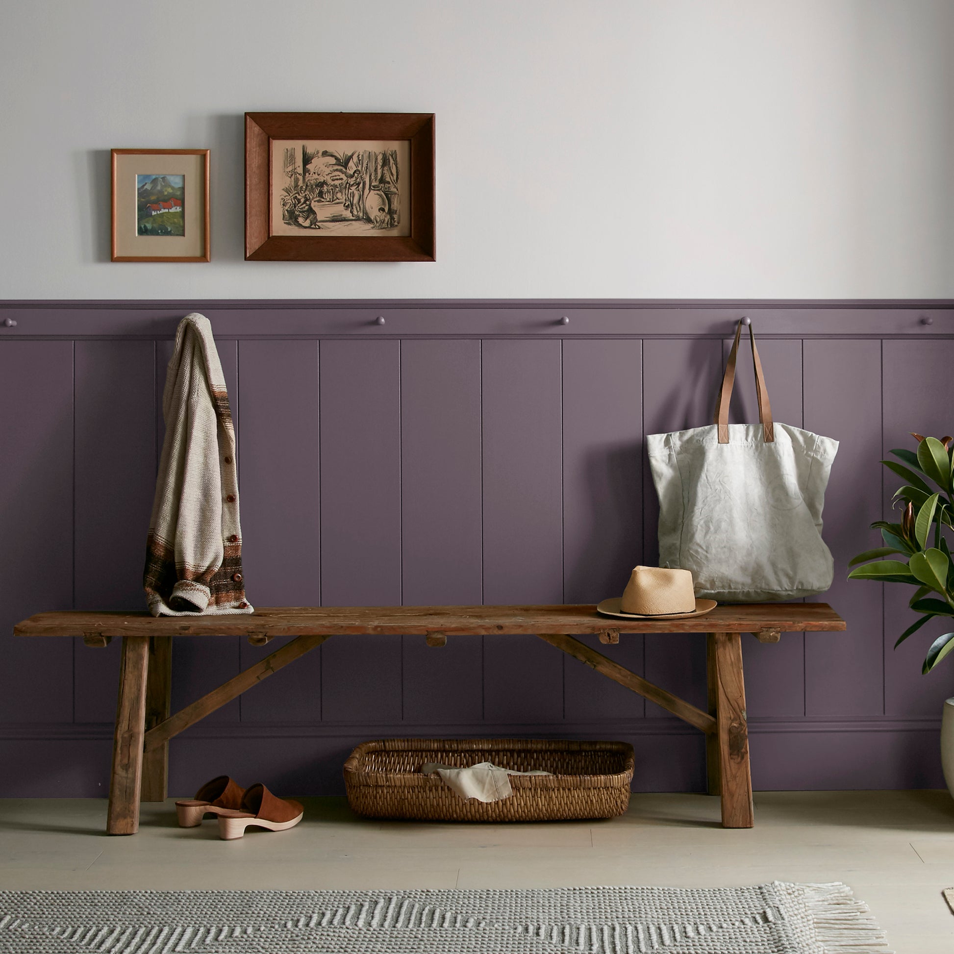 Deep eggplant purple interior paint named plum suede shown painted on entryway wall