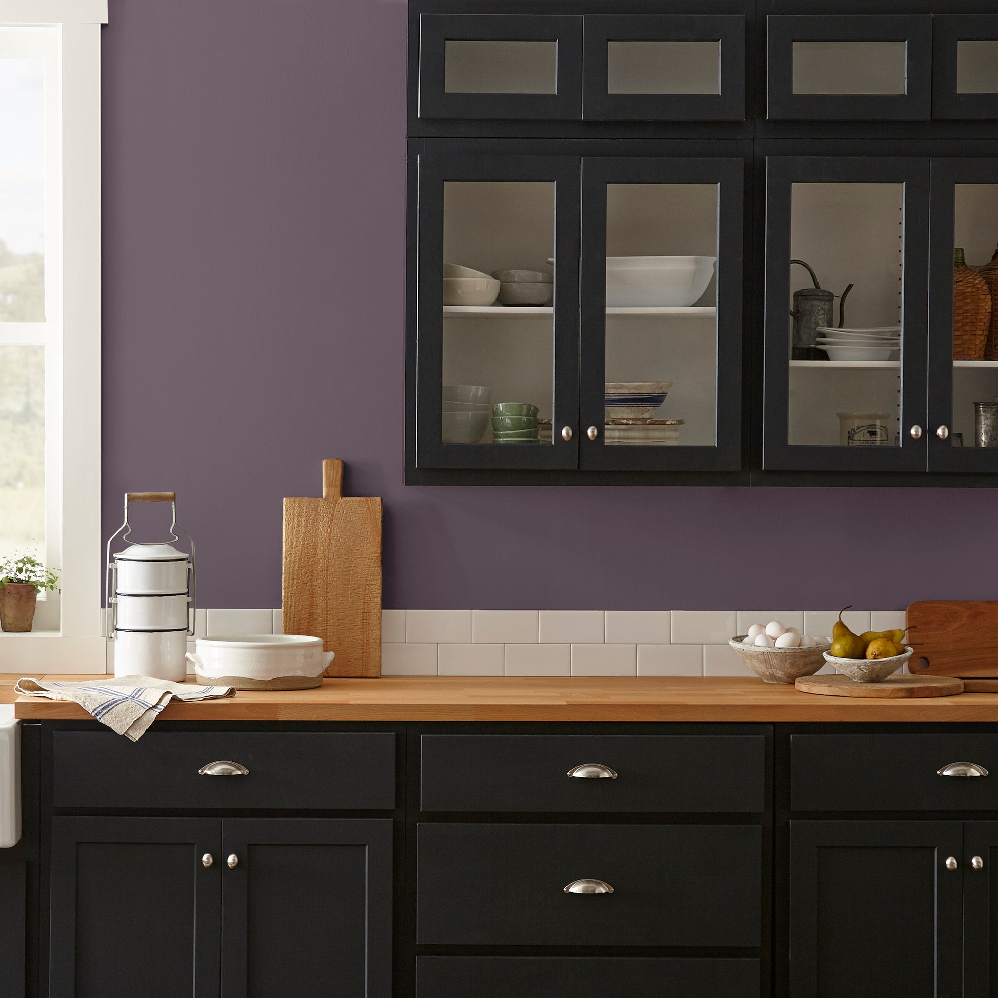 Deep eggplant purple interior paint named plum suede shown painted on kitchen wall