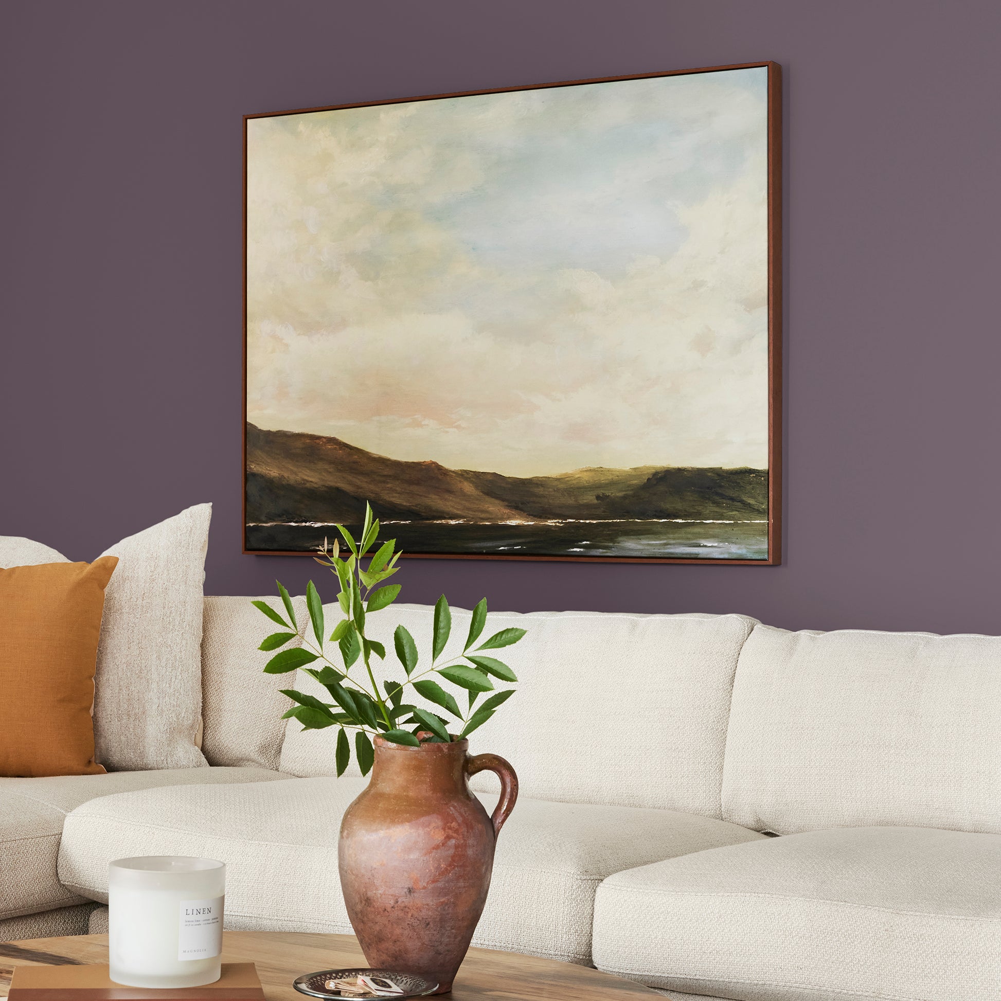 Deep eggplant purple interior paint named plum suede shown painted on living room wall