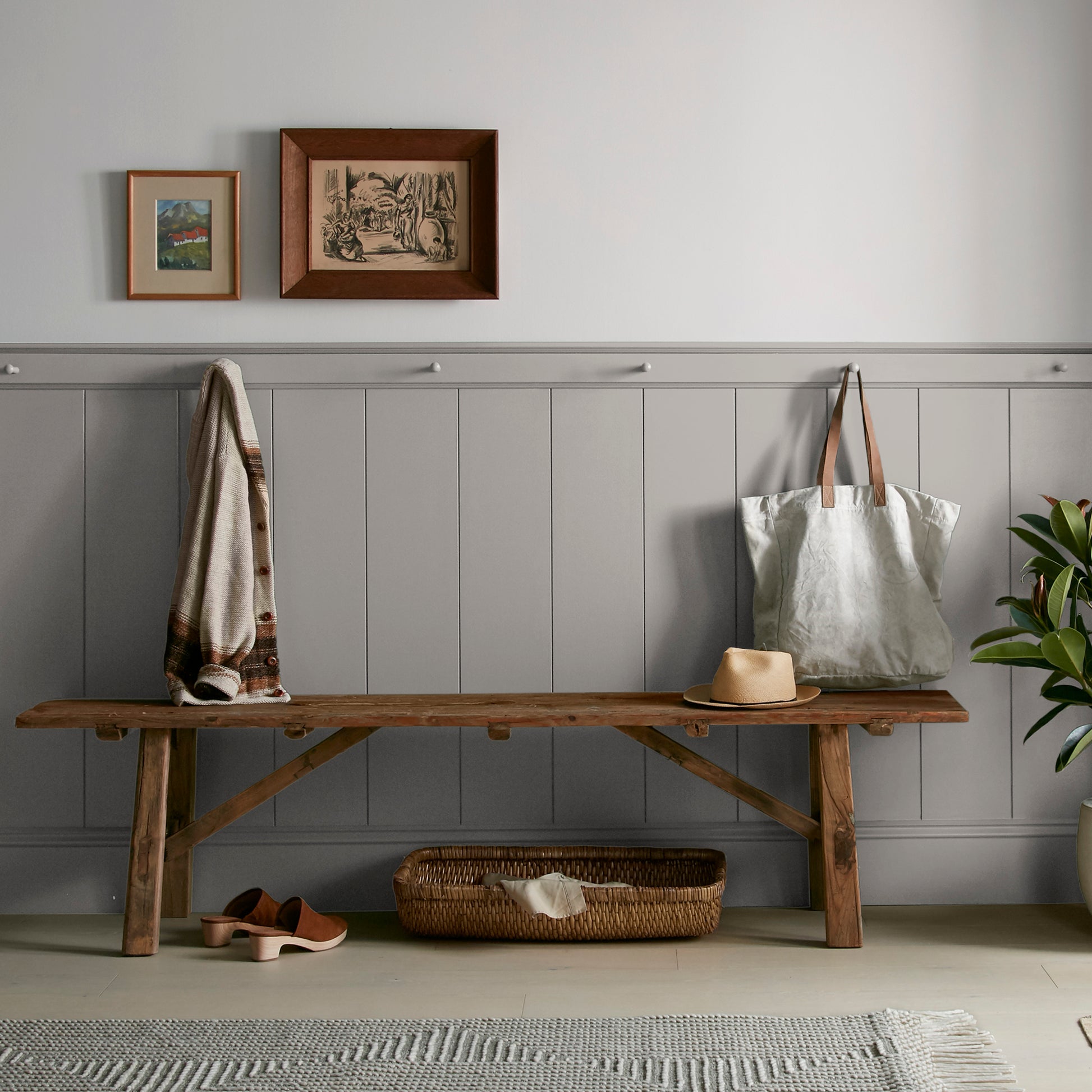 Muted gray with lavender hues interior paint named watering can shown painted on entryway wall