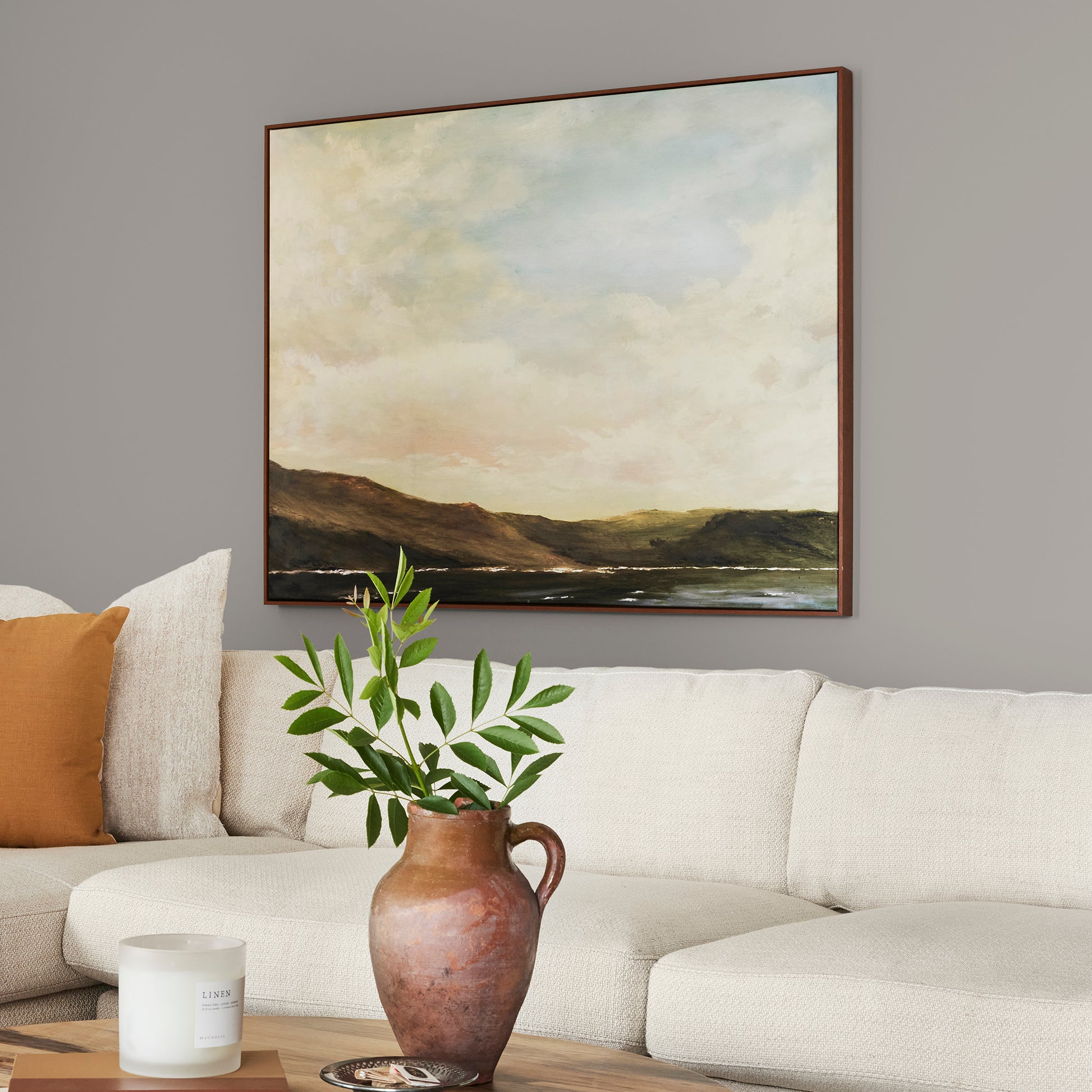 Muted gray with lavender hues interior paint named watering can shown painted on living room wall