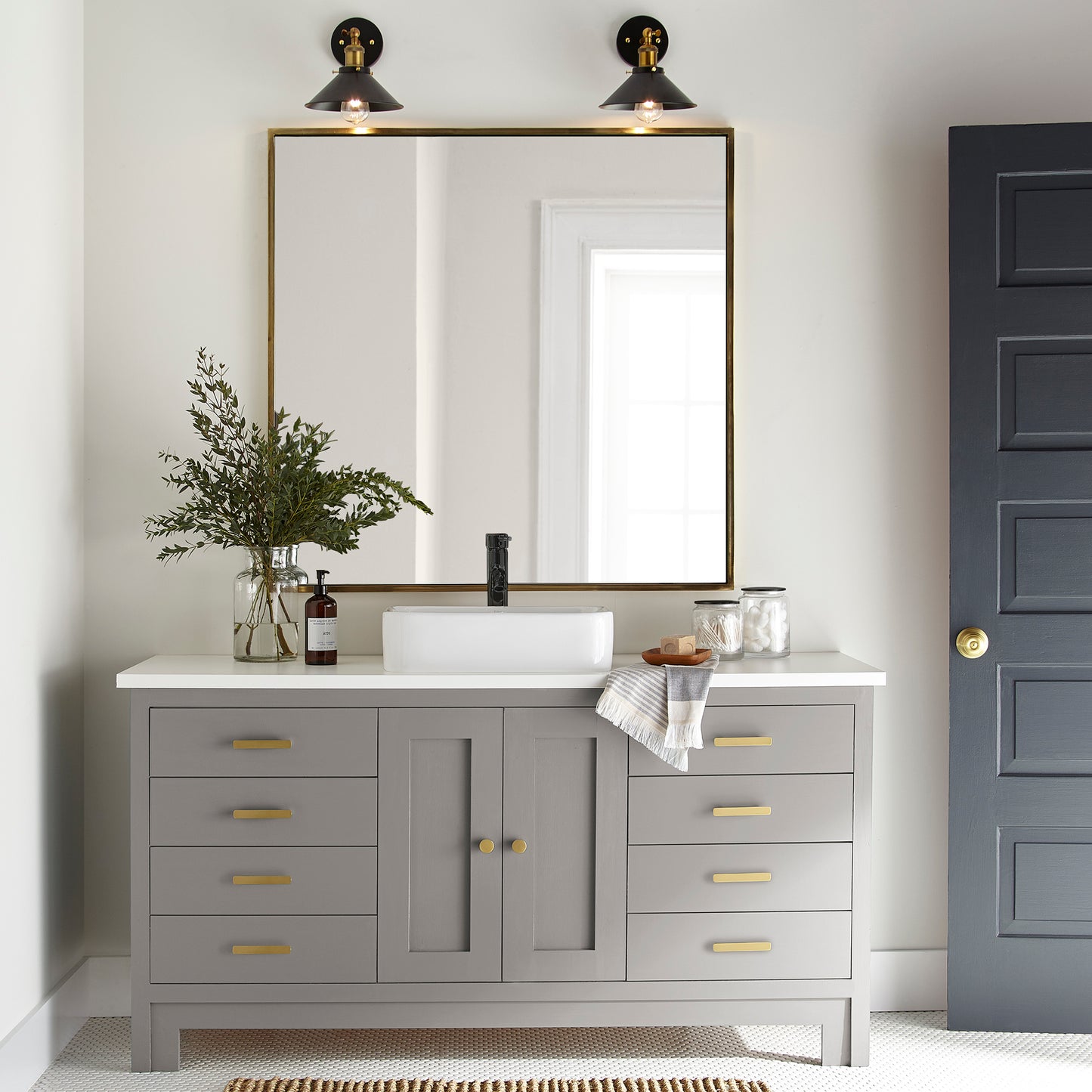 Muted gray with lavender hues door and cabinet paint named watering can shown painted on bathroom cabinet