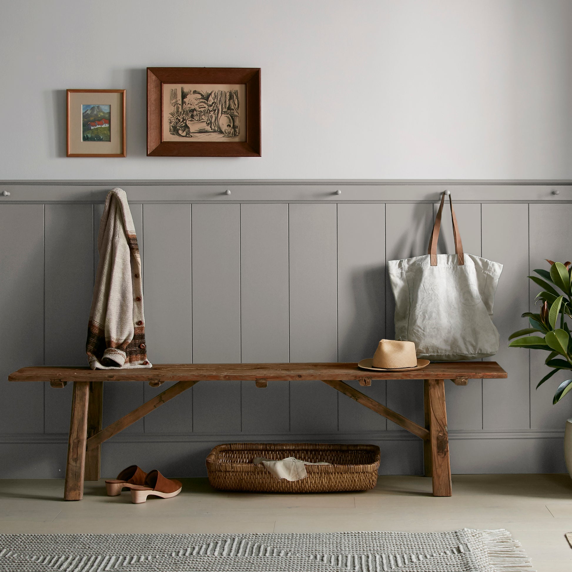 A mousy grayed brown interior paint named before and after shown painted on entryway wall