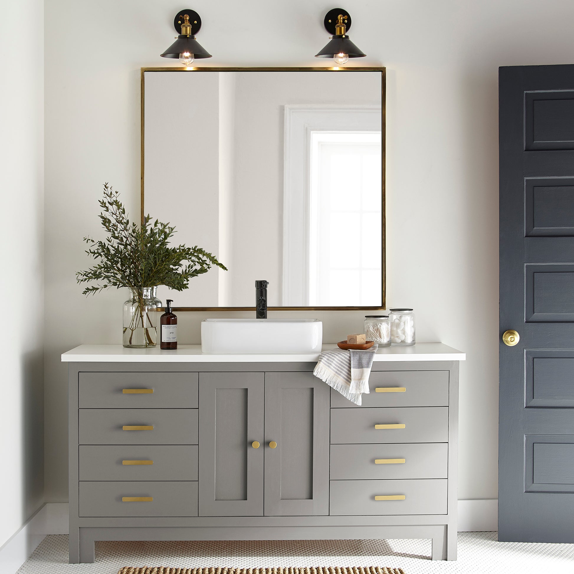 A mousy grayed brown door and cabinet paint named before and after shown painted on bathroom cabinet