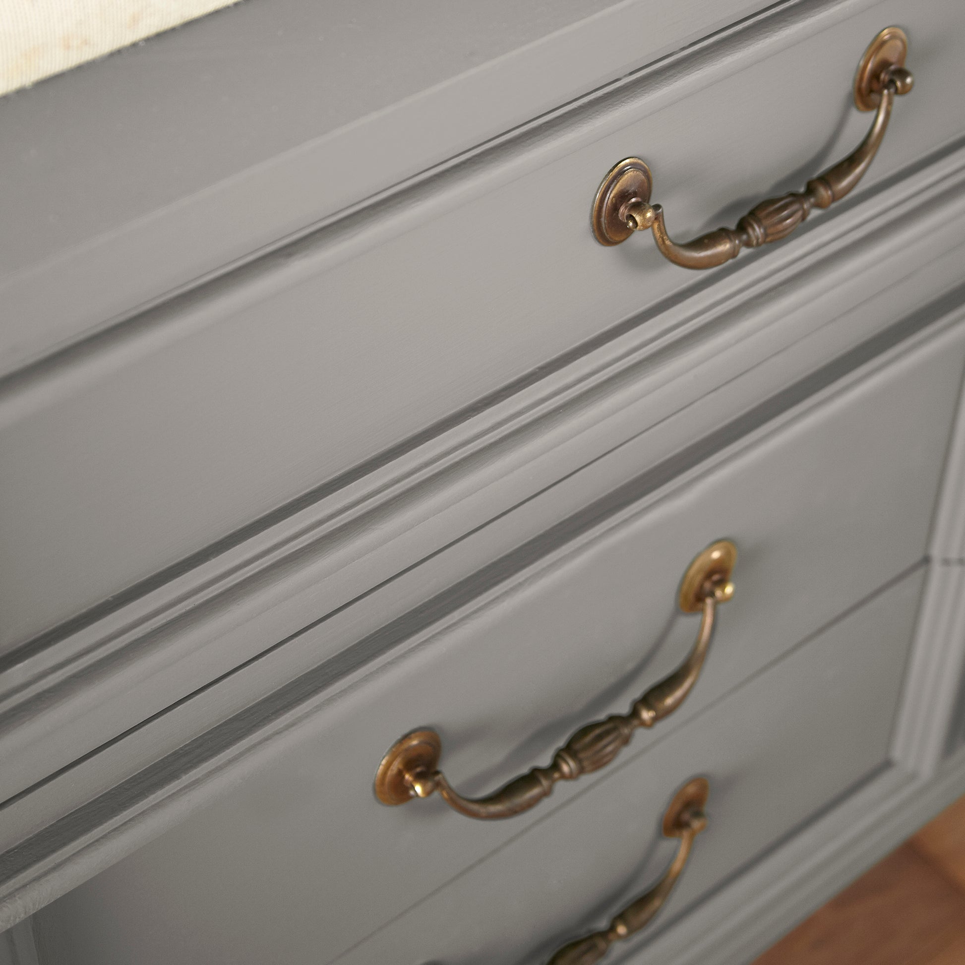 A mousy grayed brown door and cabinet paint named before and after shown painted on cabinet