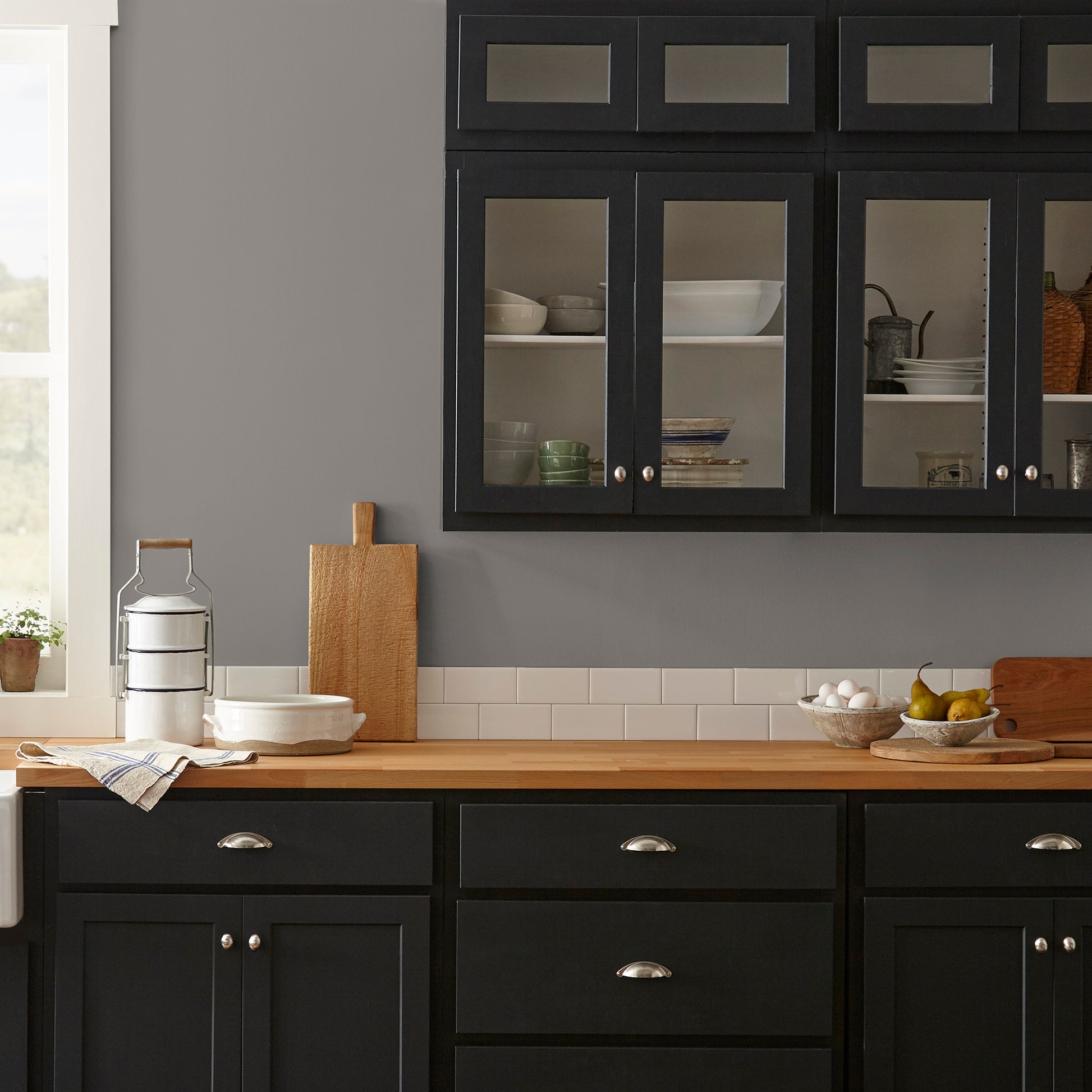 Smoky mid-toned brown interior paint named nesting box shown painted on kitchen wall