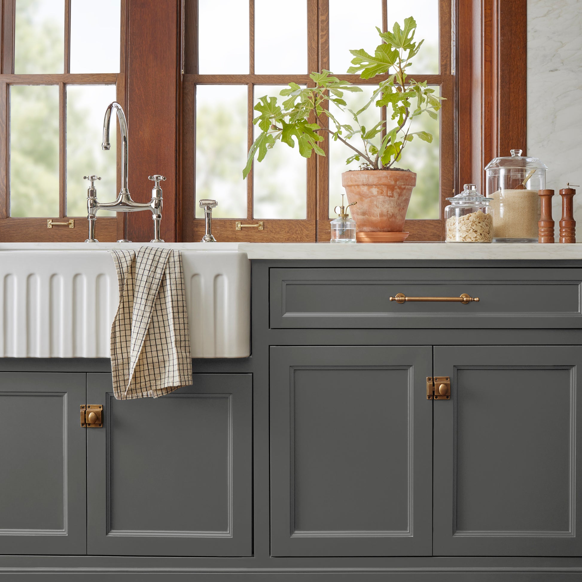 Almost black with green undertones door and cabinet paint named prairie smoke shown painted on kitchen cabinet