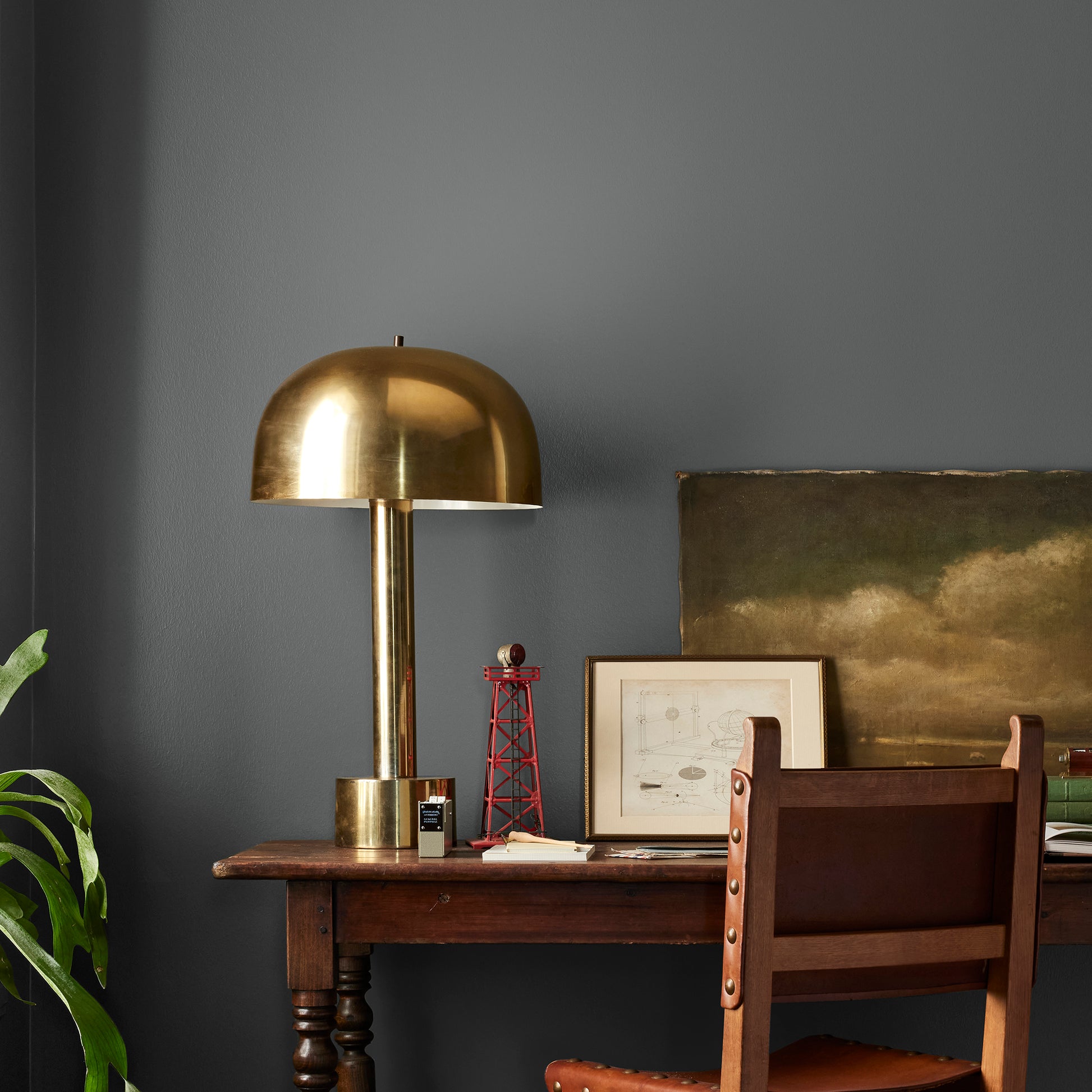 A chalky black interior paint named aspen stone shown painted on bedroom wall