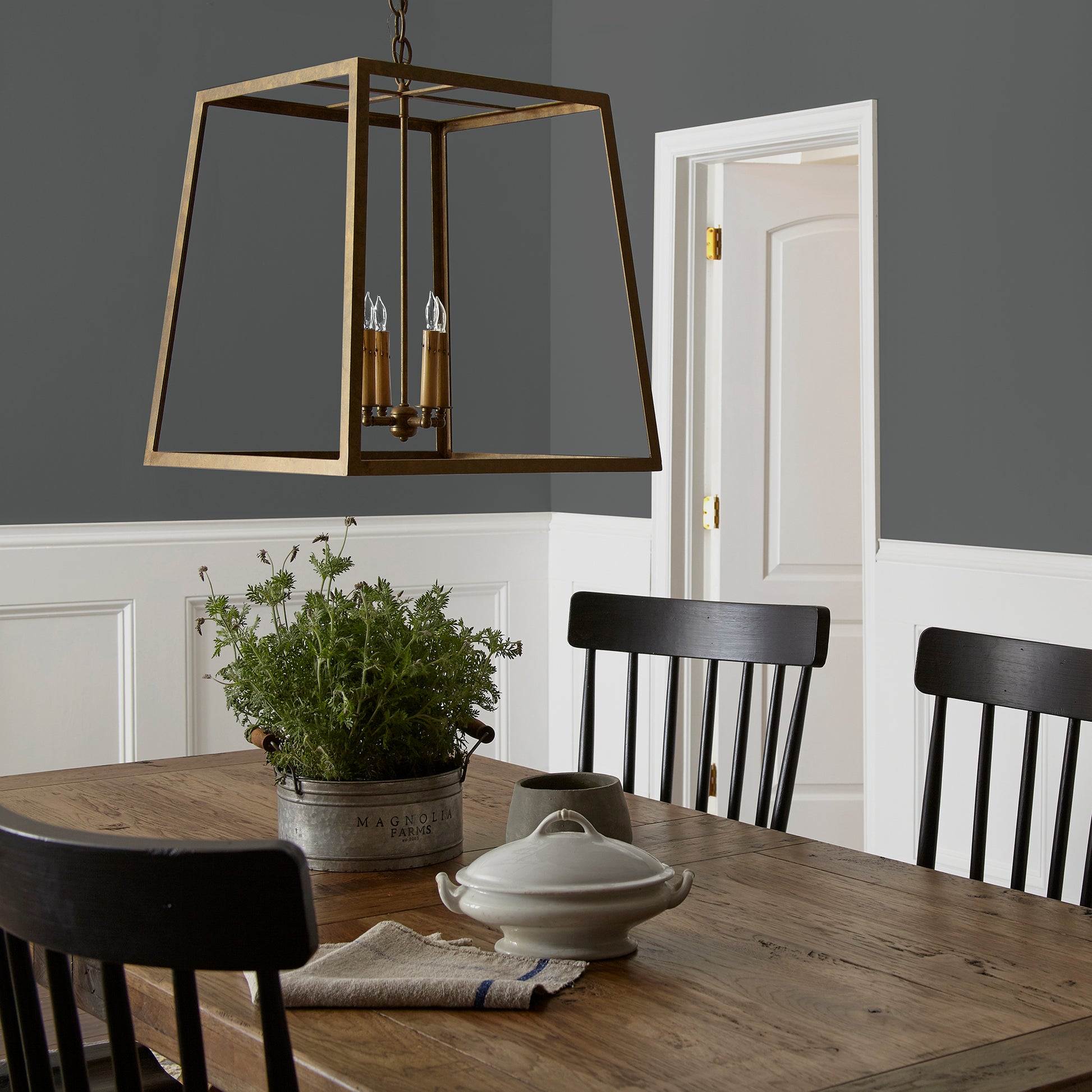 A chalky black interior paint named aspen stone shown painted on dining room wall