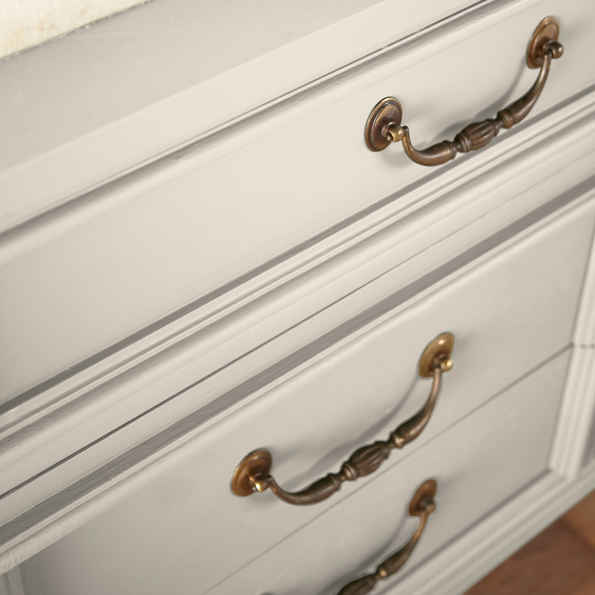 A creamy, soft white with a timeless essence door and cabinet paint named castle cream shown painted on cabinet