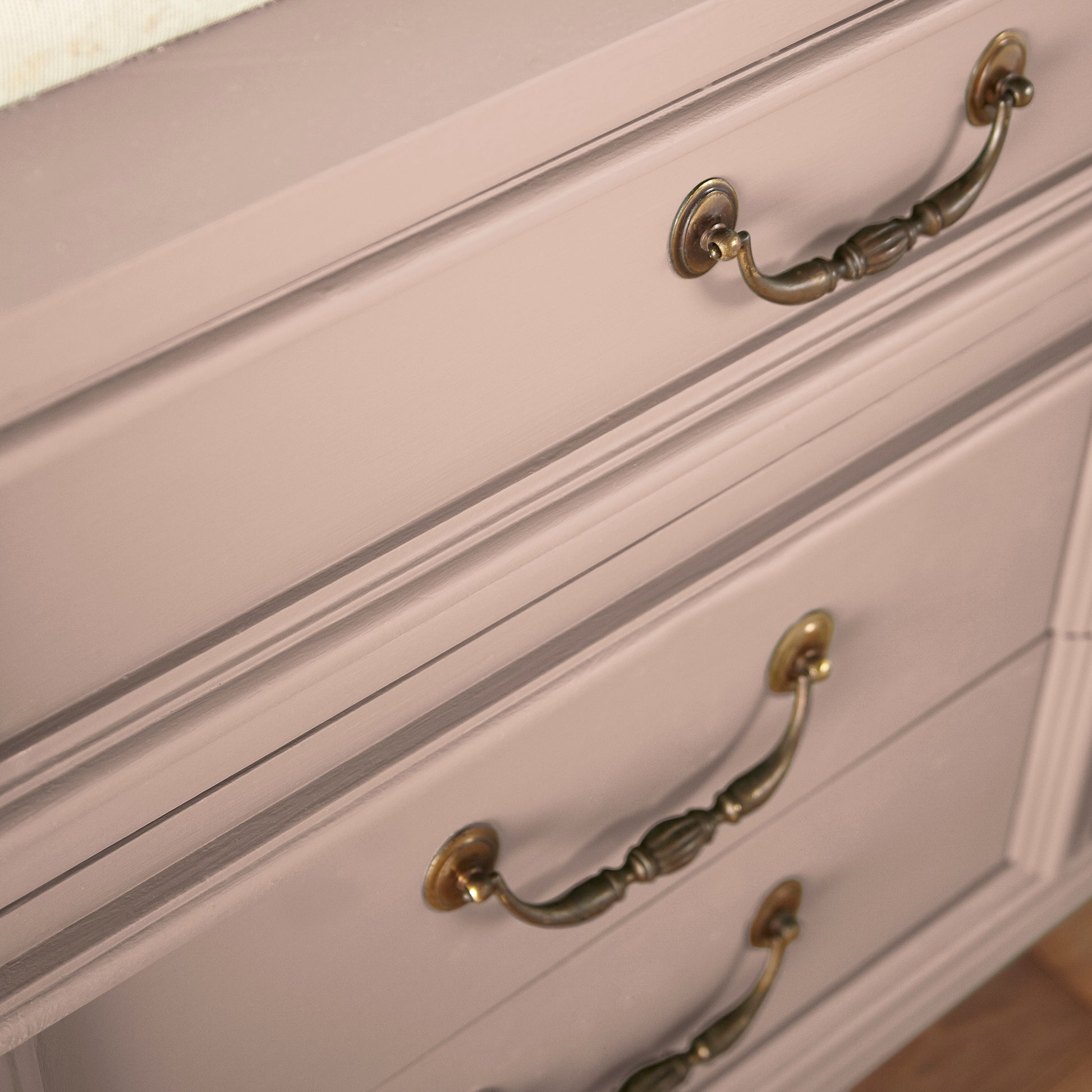 A dusty, subtle pink with a nostalgic tone door and cabinet paint named rosy pink shown painted on cabinet