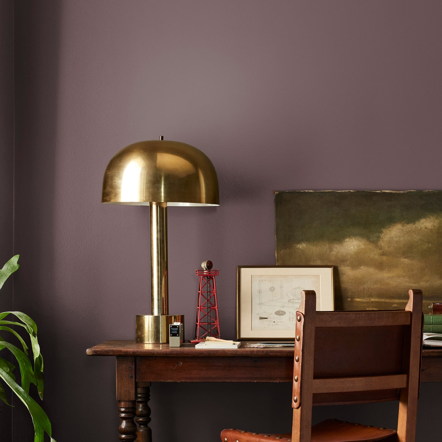 A rich burgundy interior paint named Moody Fig shown painted on bedroom wall
