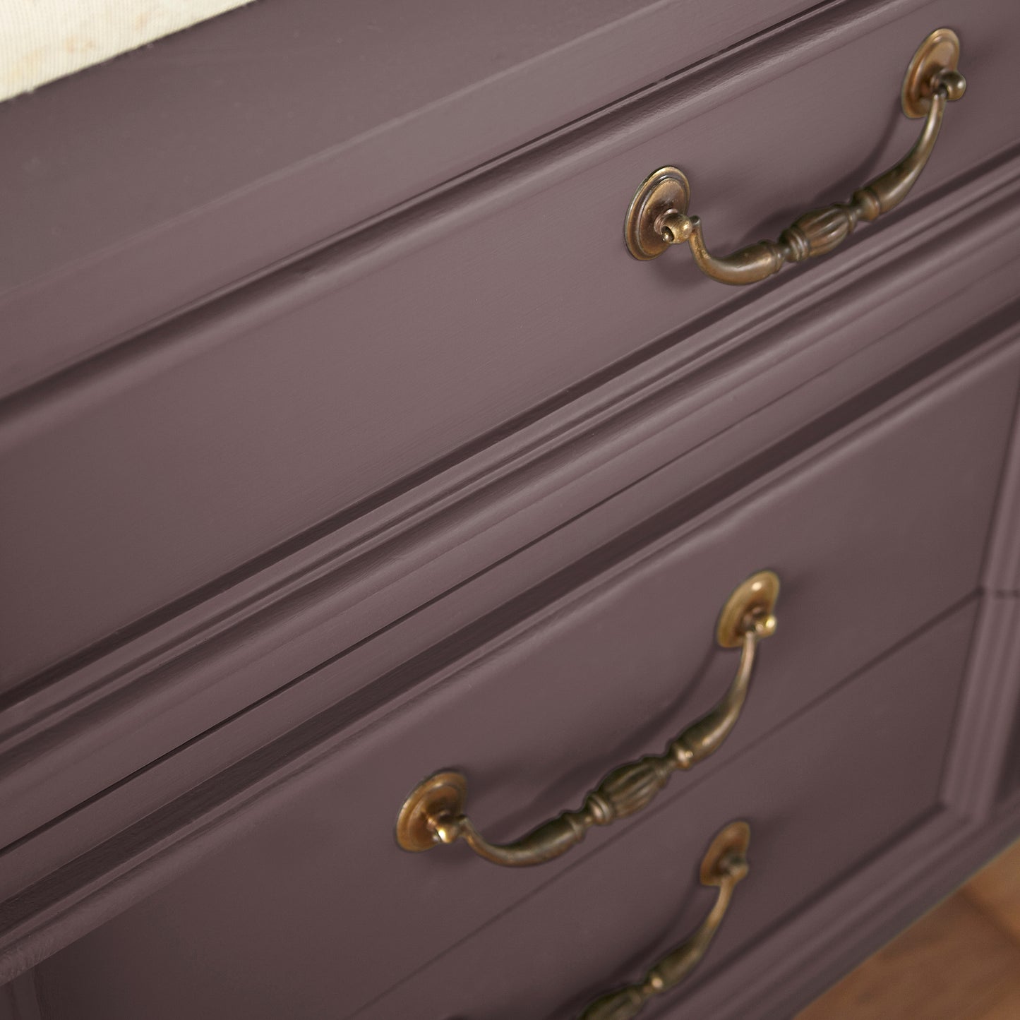 A beautifully saturated burgundy door and cabinet paint named moody fig shown painted on cabinet