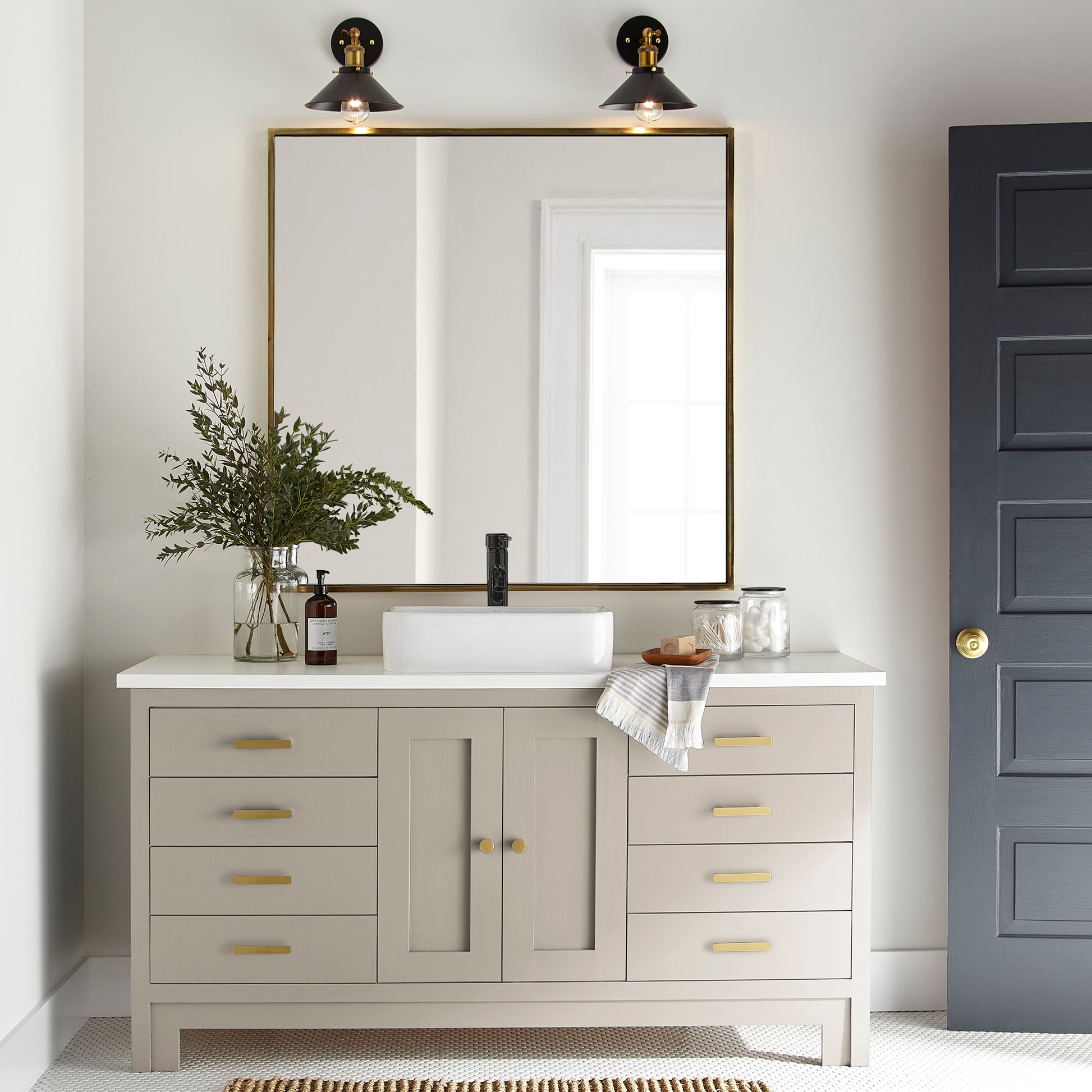 A light beige with a warm, soothing tone door and cabinet paint named plaster shown painted on bathroom cabinet