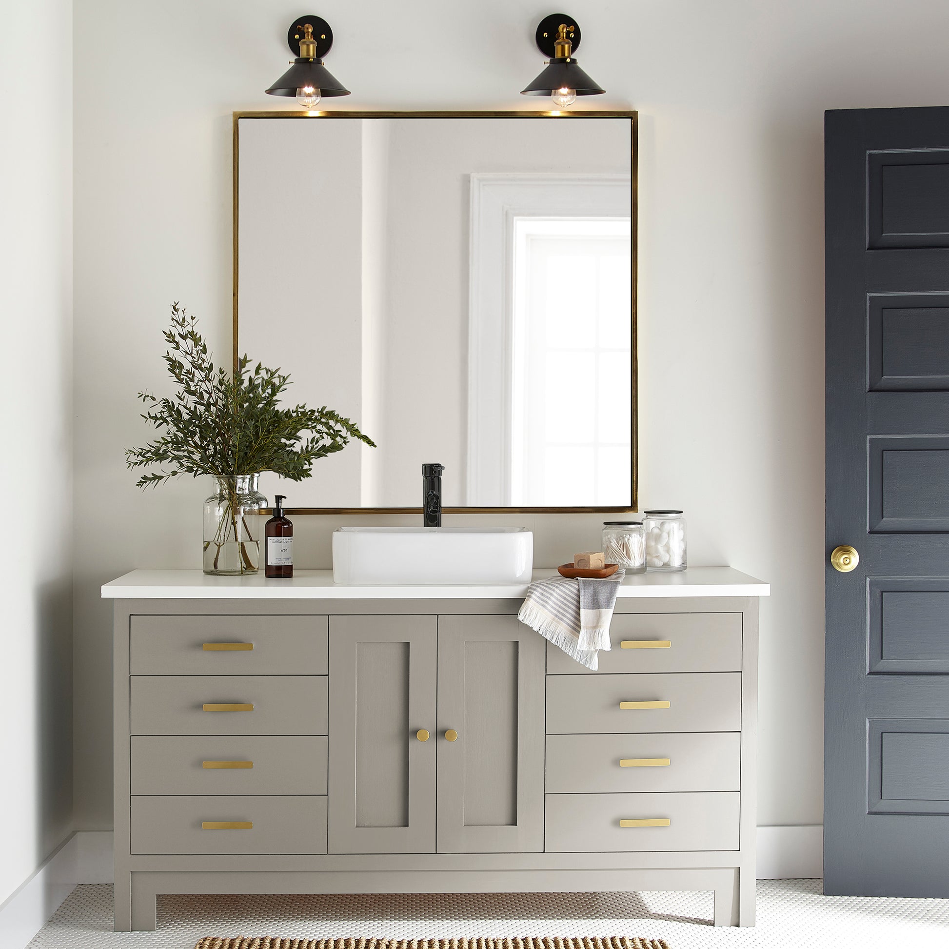 A soft French gray door and cabinet paint named drawing room shown painted on bathroom cabinet