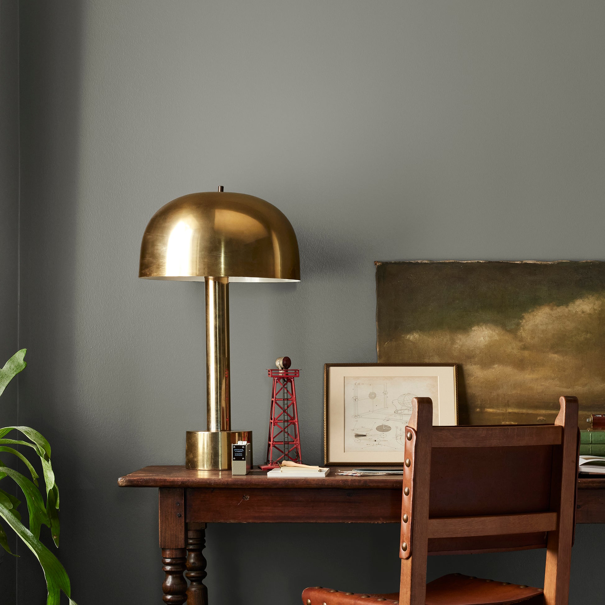 Sage green with gray undertones interior paint named estate shown painted on bedroom wall