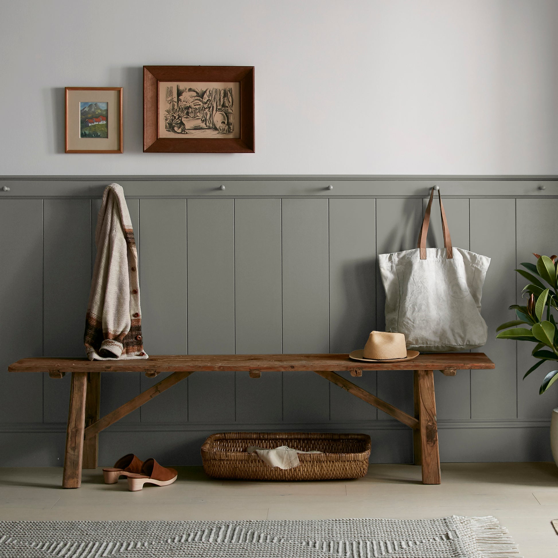Sage green with gray undertones interior paint named estate shown painted on entryway wall